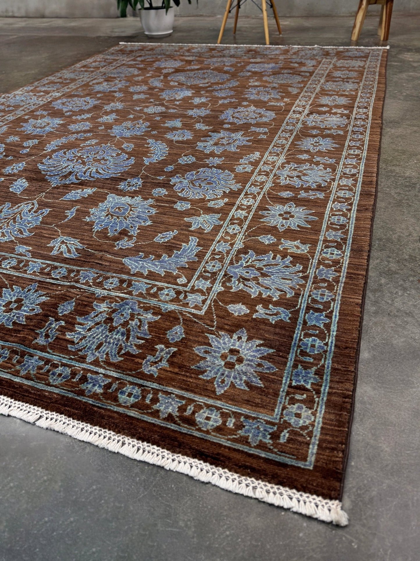Brand new handmade floral rug with walnut brown, blue and soft turquoise accents, wool area rug 7x9 from Indigo Rugs Burlingame Bay Area.