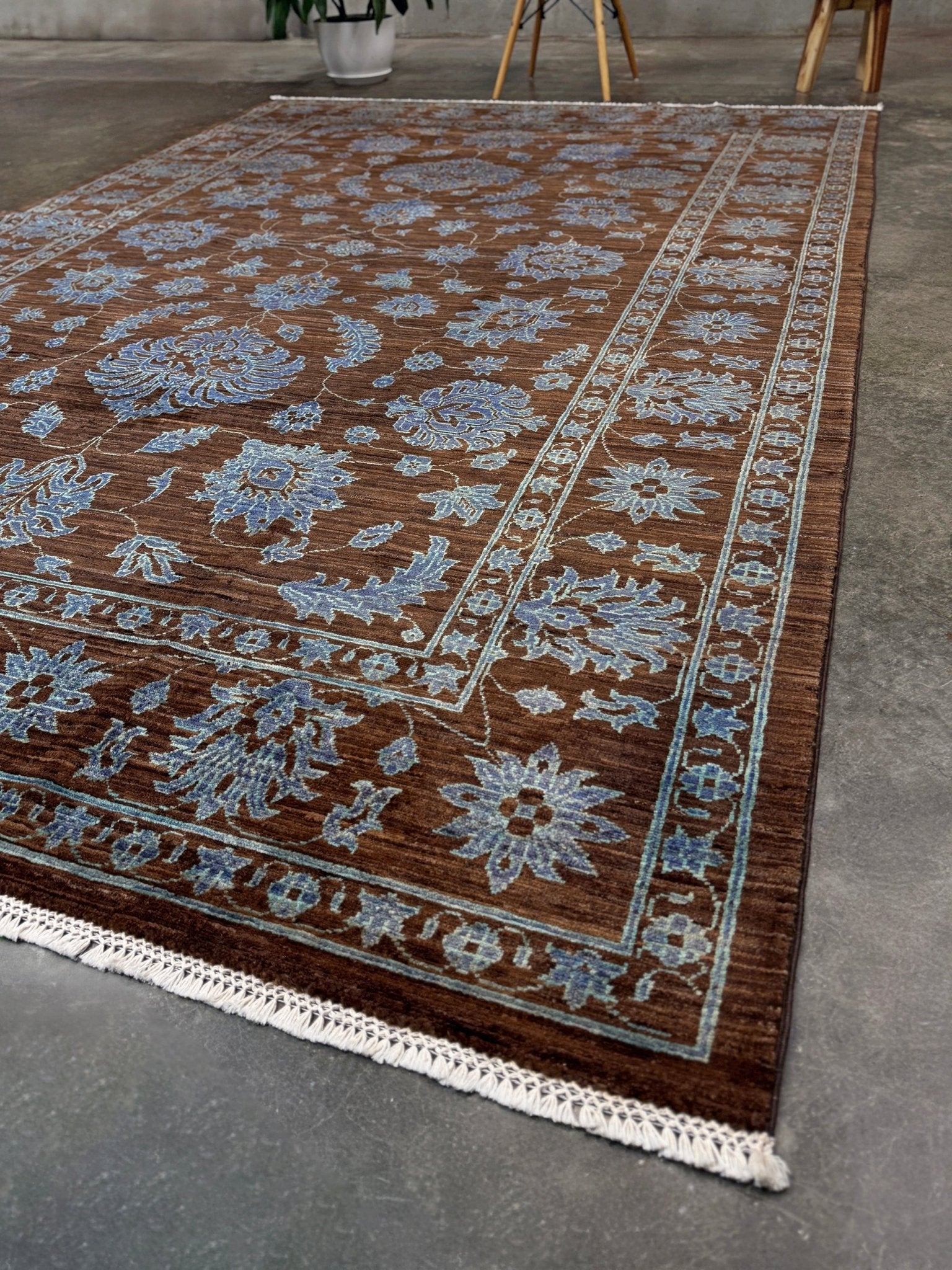 Brand new handmade floral rug with walnut brown, blue and soft turquoise accents, wool area rug 7x9 from Indigo Rugs Burlingame Bay Area.