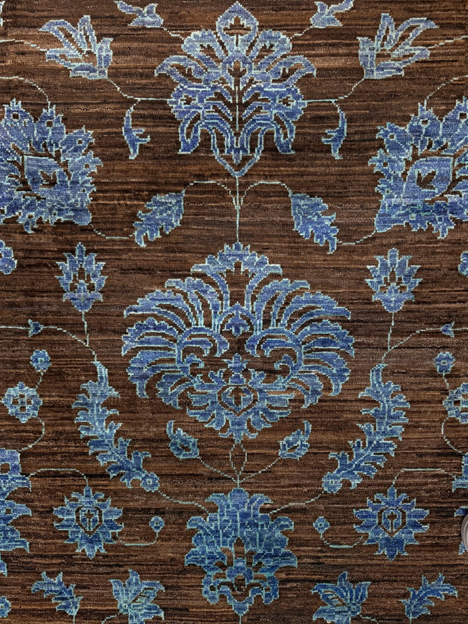 Brand new handmade floral rug with walnut brown, blue and soft turquoise accents, wool area rug 7x9 from Indigo Rugs Burlingame Bay Area.