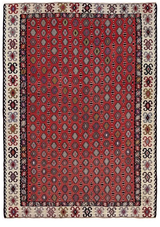 Decorative rug with intricate pattern on a red background. Vintage Pirot kilim with warm madder red field and repeating geometric medallions, handwoven wool flatweave rug with ivory border, approx. 7x10.