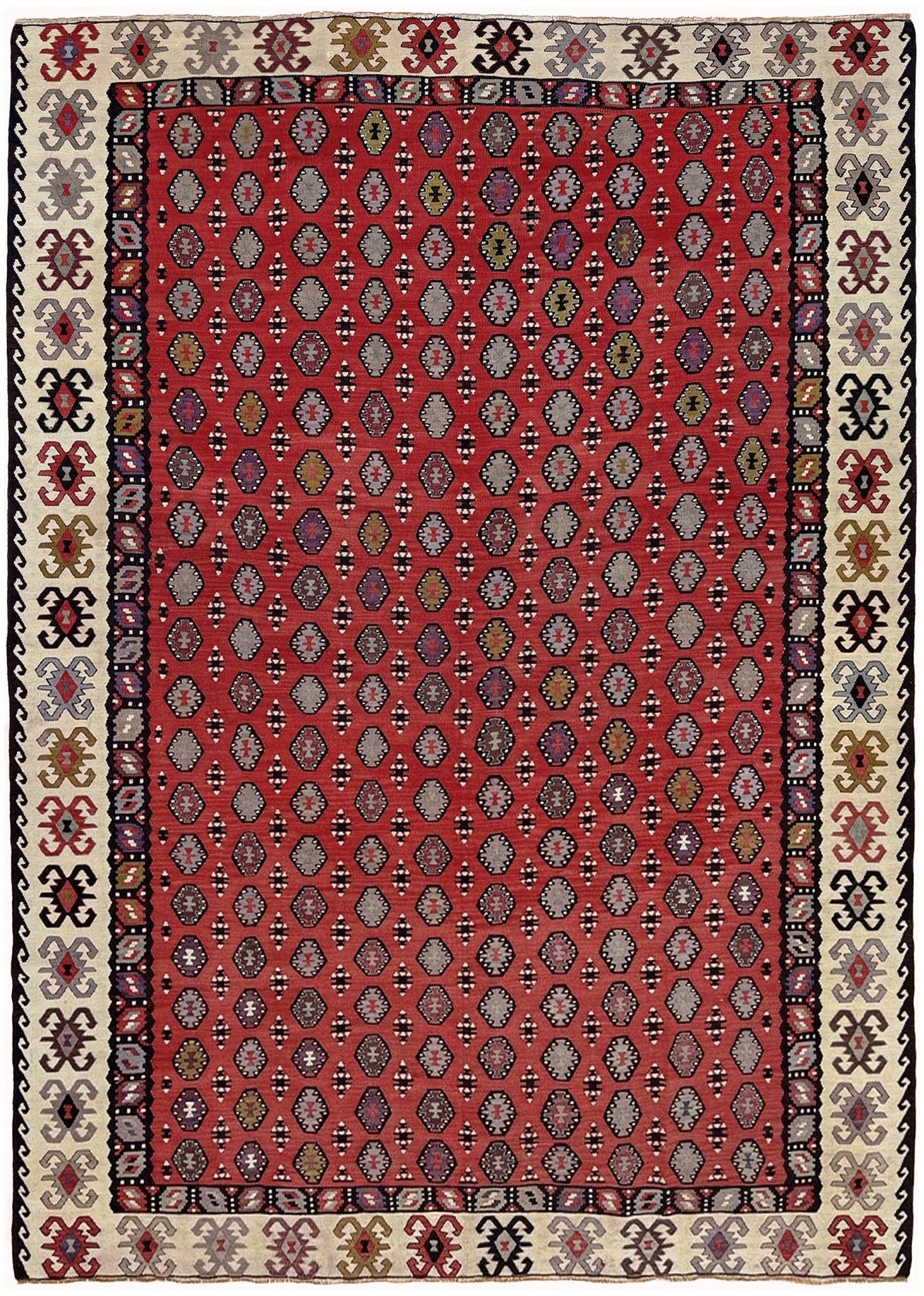 Red patterned rug with geometric designs on a red background. Decorative rug with intricate pattern on a red background. Vintage Pirot kilim with warm madder red field and repeating geometric medallions, handwoven wool flatweave rug with ivory border, approx. 7x10.