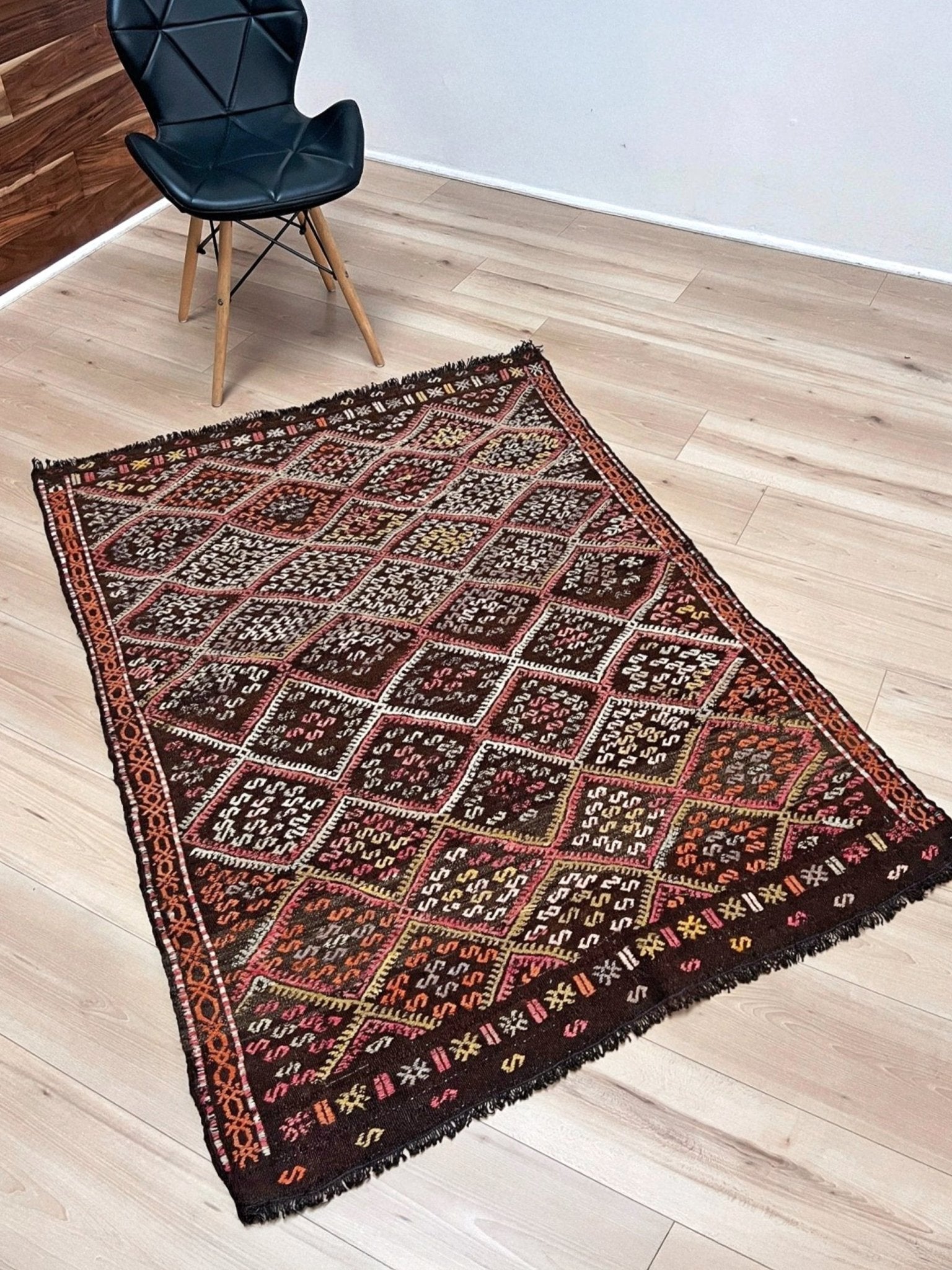 Vintage Turkish cicim kilim rug, approx. 4x6, with deep espresso brown field and diamond motifs in dusty rose, amber, soft terracotta, muted olive green, ivory, and subtle mauve tones. Handwoven wool flatweave from Indigo Rugs, Burlingame — San Francisco Bay Area.