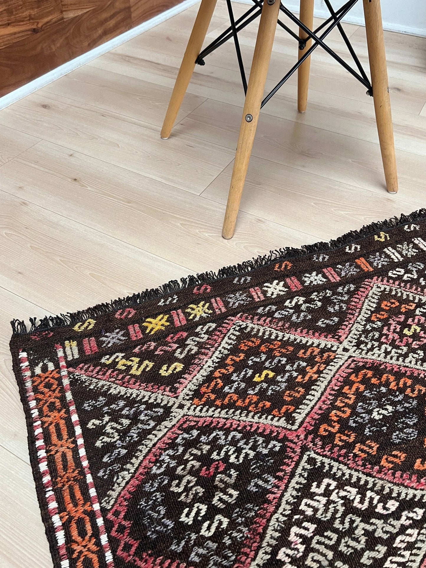 4x6 Vintage Malatya Cicim Turkish kilim rug with embroidered diamond motifs in rose, amber, and ivory on a charcoal brown field — handmade wool flatweave from the 1940s, available at Indigo Rugs, the best rug shop in San Francisco Bay Area, Burlingame CA.
