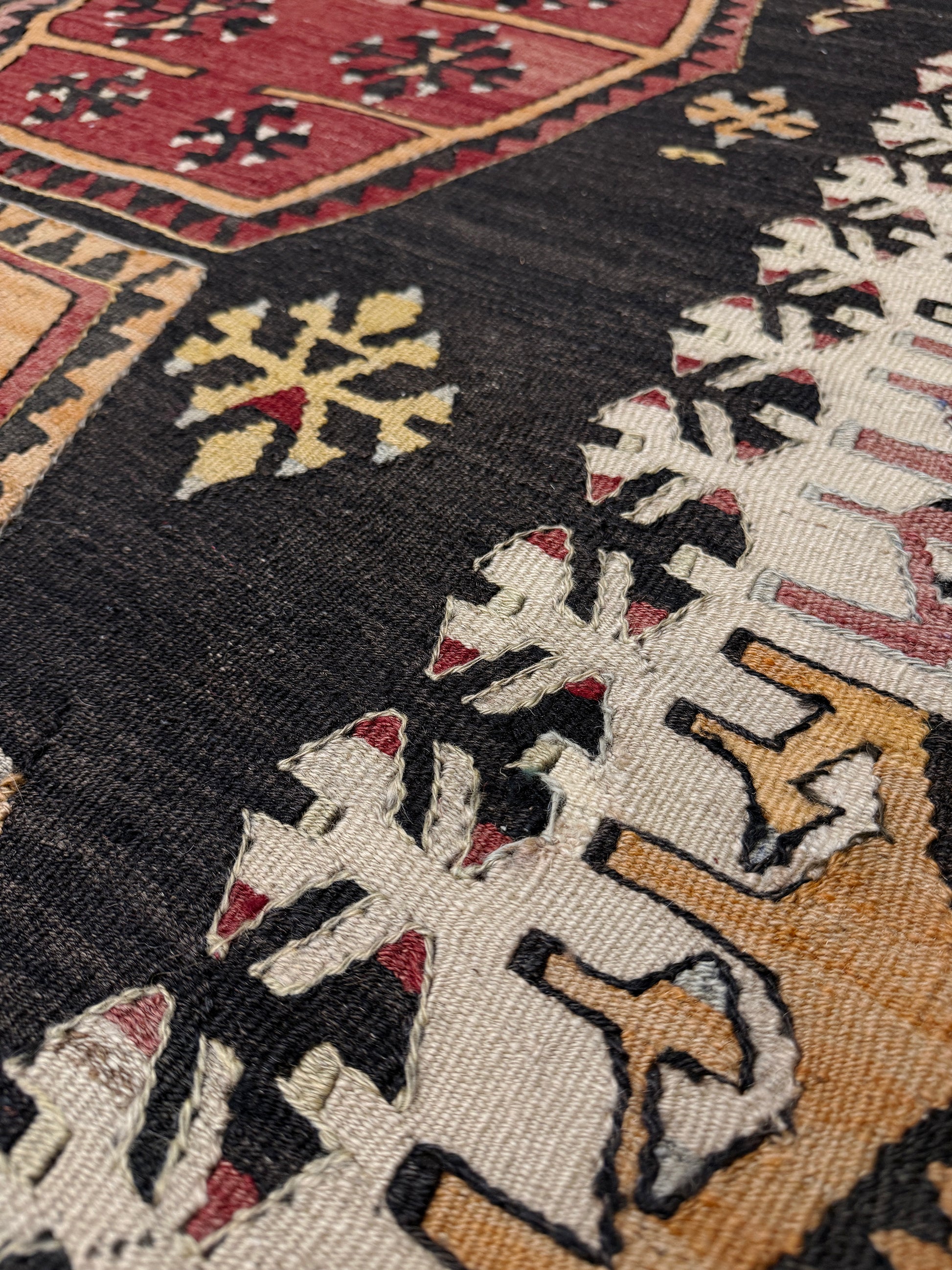 Vintage Sarkisla Turkish kilim rug 6x9 with deep brown field and geometric medallions in madder red, camel, and ivory tones — handmade Anatolian flatweave carpet