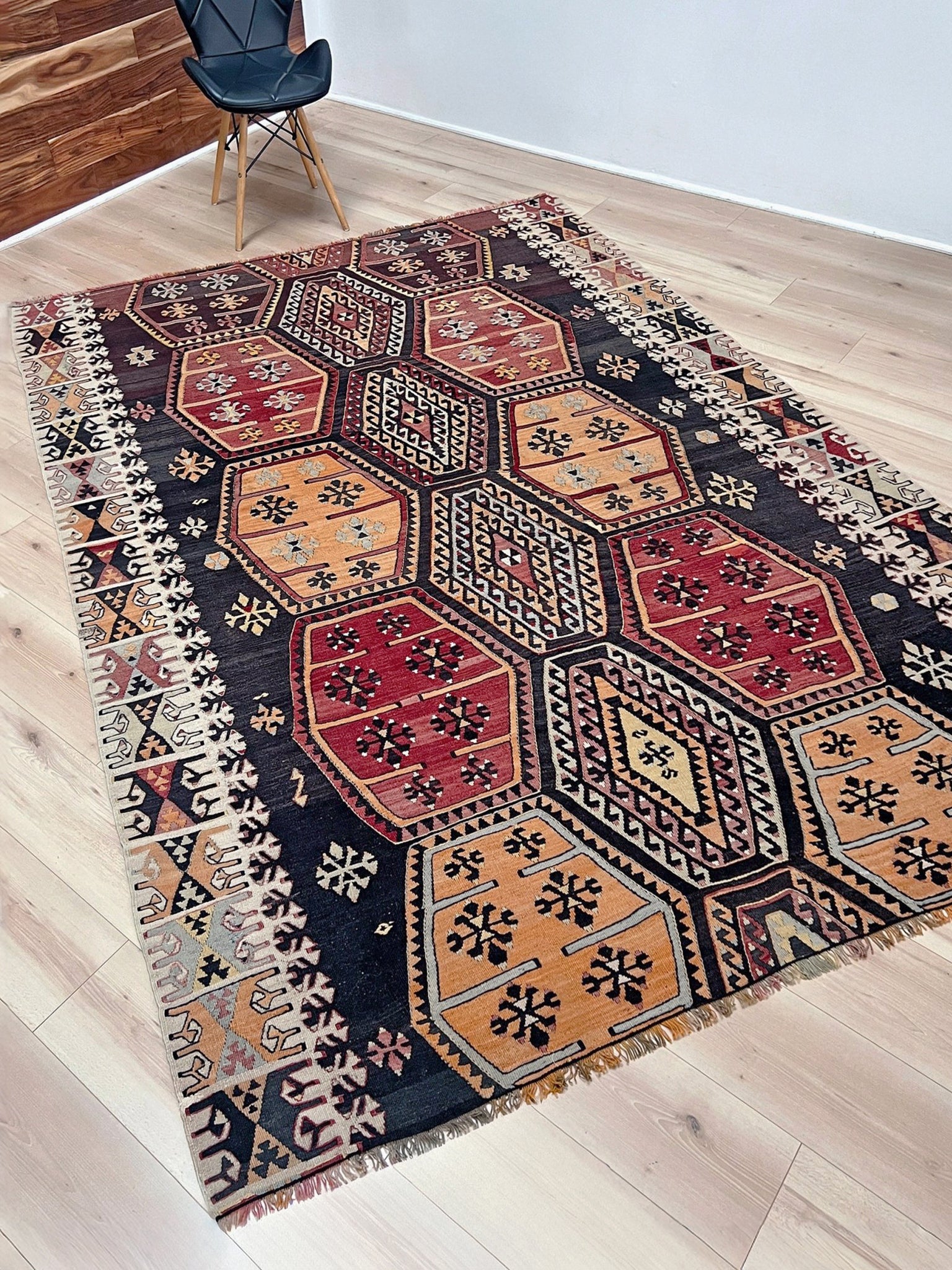 Vintage Sarkisla Turkish kilim rug 6x9 with deep brown field and geometric medallions in madder red, camel, and ivory tones — handmade Anatolian flatweave carpet