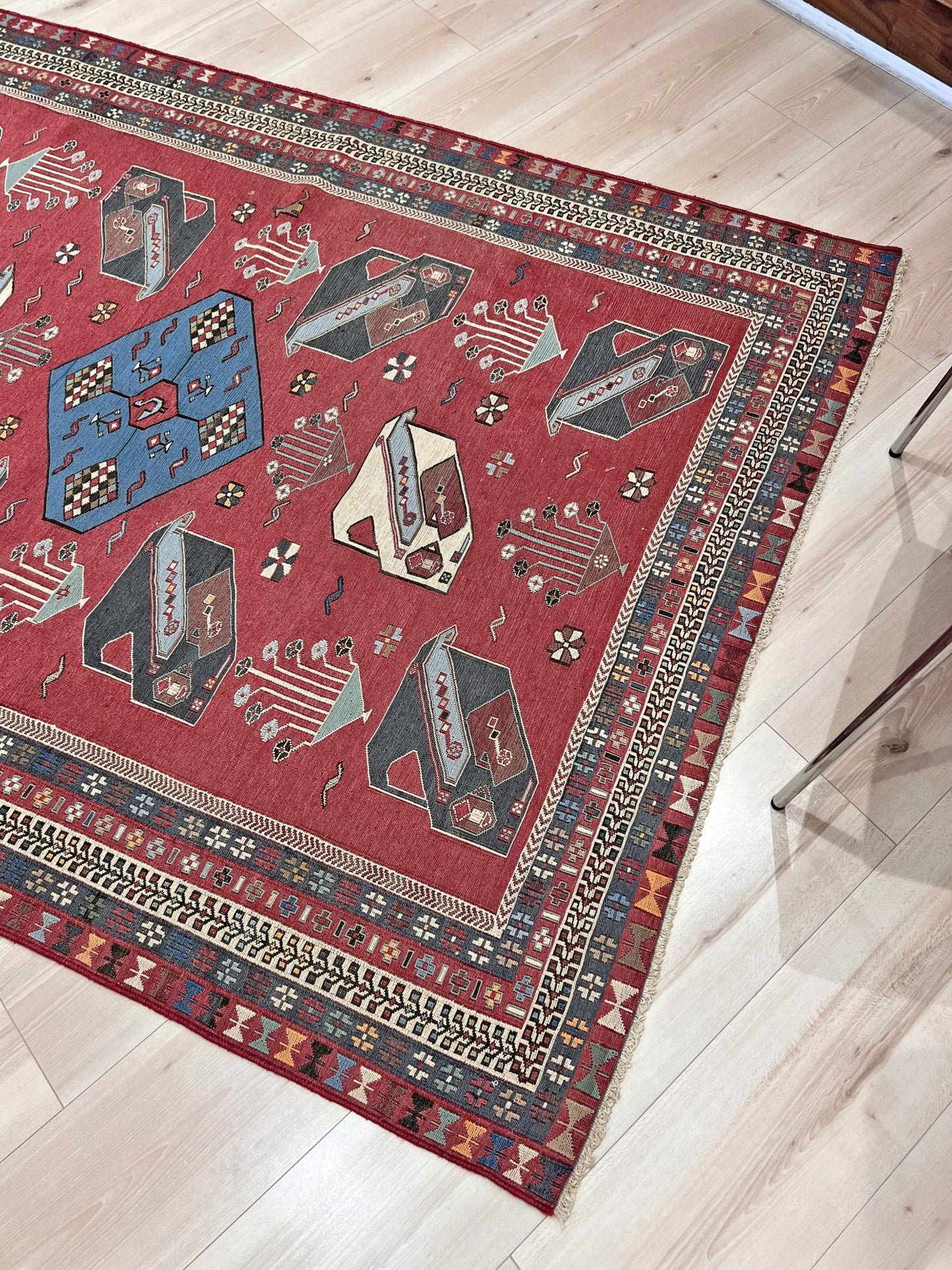 Vintage Armenian soumak rug with pictorial motifs in madder red, slate blue, ivory, and charcoal, 4x6 size.