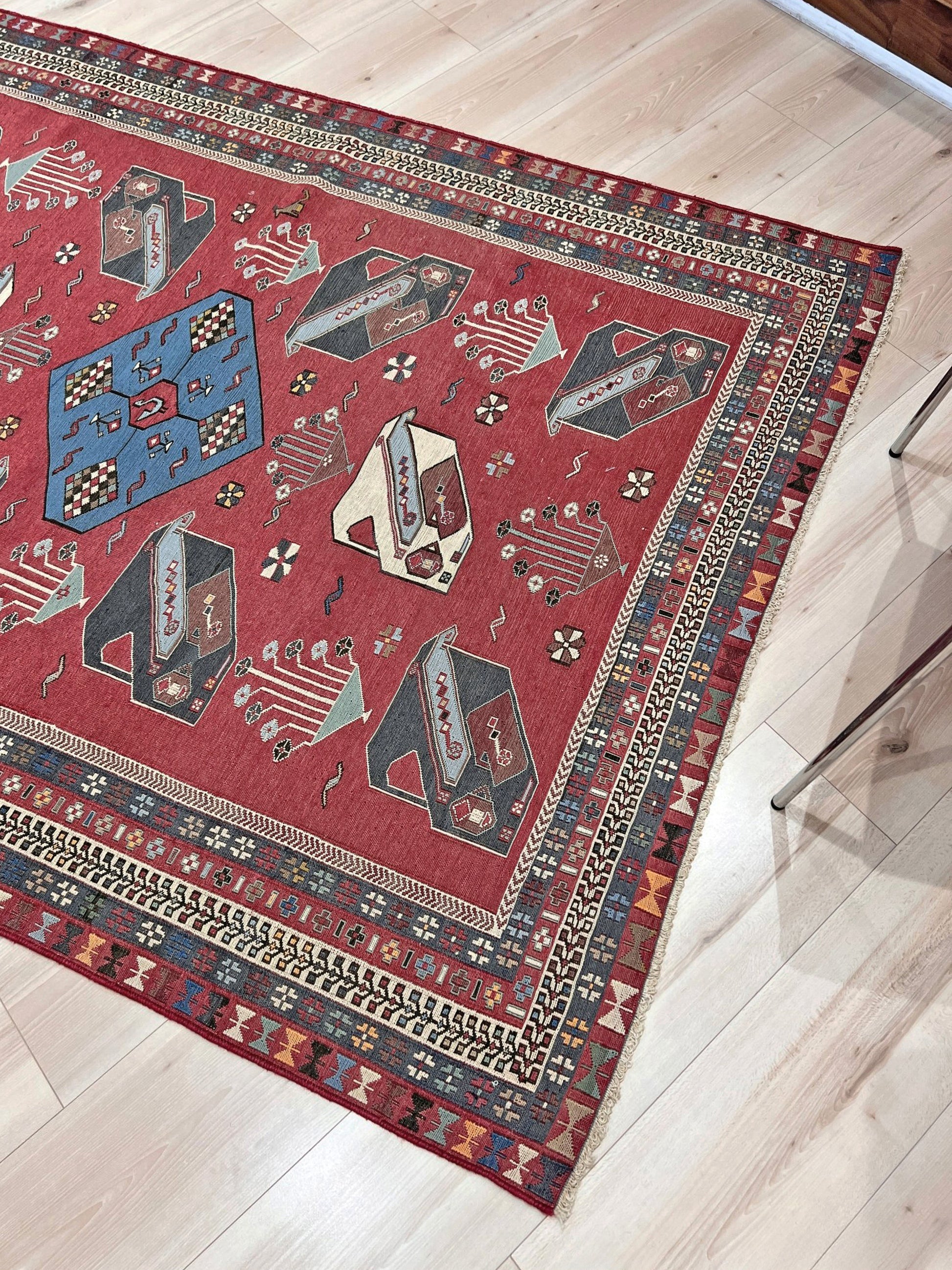 Vintage Armenian soumak rug with pictorial motifs in madder red, slate blue, ivory, and charcoal, 4x6 size.