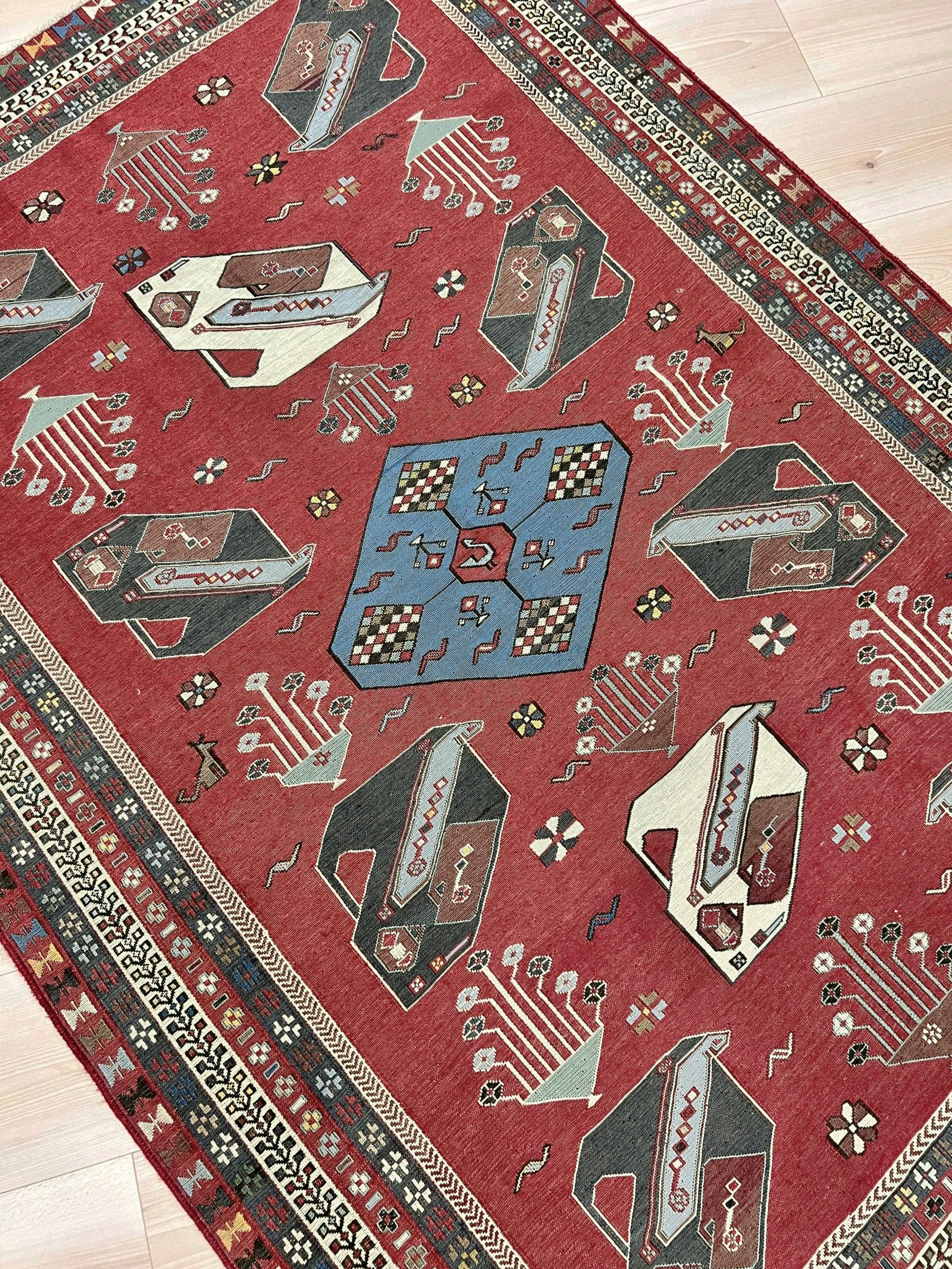 Vintage Armenian soumak rug with pictorial motifs in madder red, slate blue, ivory, and charcoal, 4x6 size.