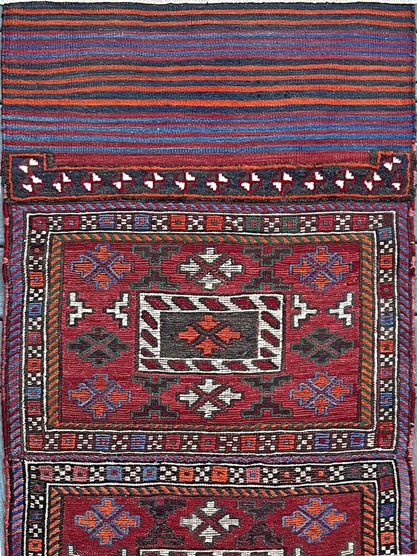 Vintage Bakhtiari Khorjin saddle bag rug 2x6 — 1940s Persian tribal runner handwoven with flatweave, pile, and soumak techniques in crimson, indigo, orange, and ivory — antique wool rug from Northwest Persia, Indigo Rugs Burlingame CA.