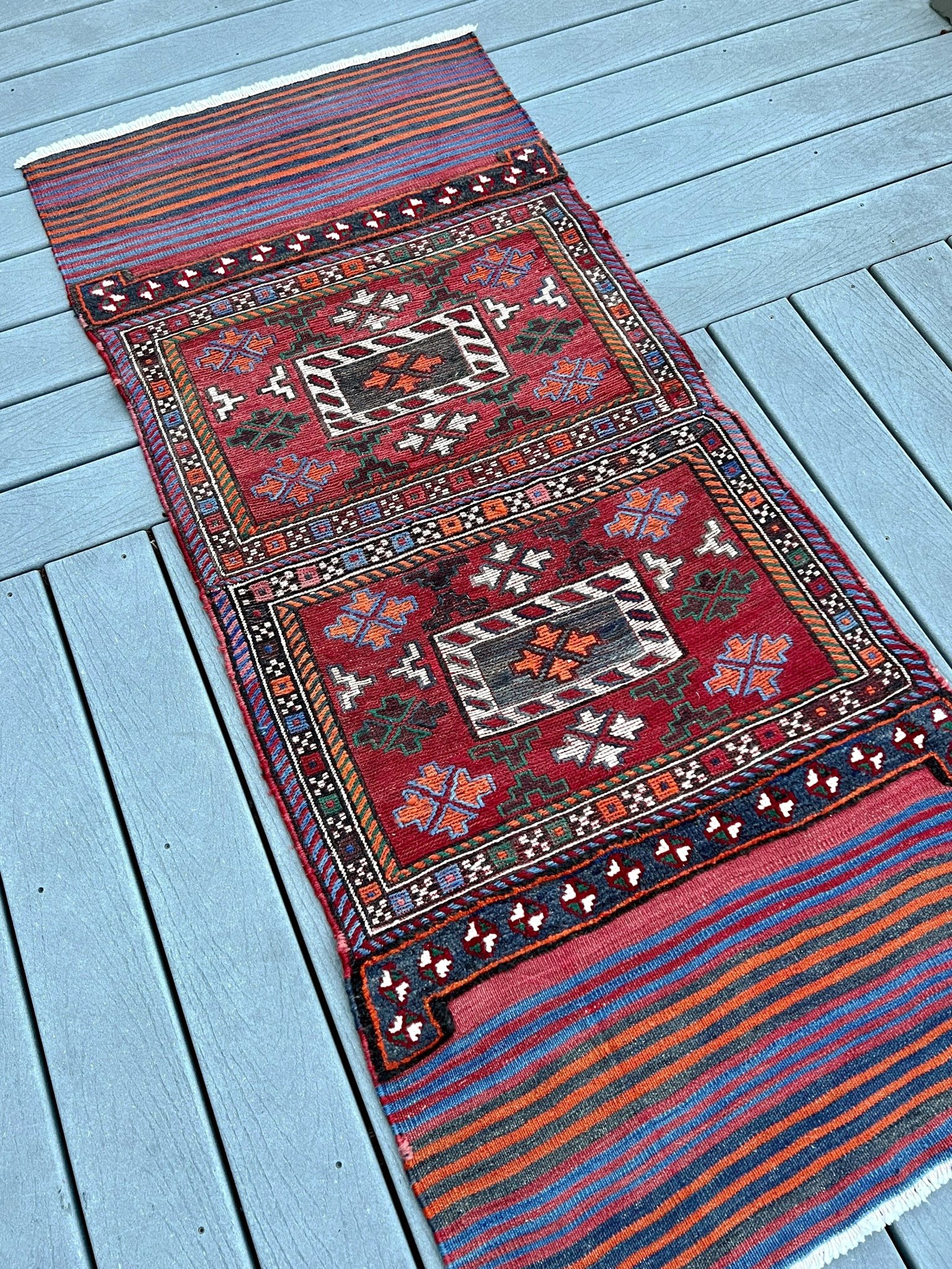 Vintage Bakhtiari Khorjin saddle bag rug 2x6 — 1940s Persian tribal runner handwoven with flatweave, pile, and soumak techniques in crimson, indigo, orange, and ivory — antique wool rug from Northwest Persia, Indigo Rugs Burlingame CA.