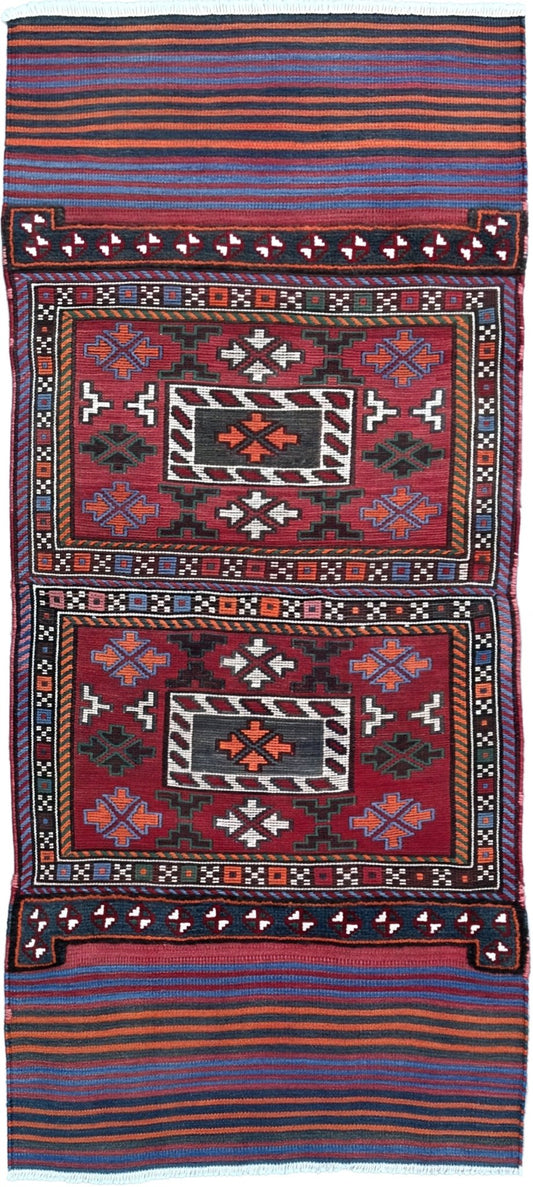 Vintage Bakhtiari Khorjin saddle bag rug 2x6 — 1940s Persian tribal runner handwoven with flatweave, pile, and soumak techniques in crimson, indigo, orange, and ivory — antique wool rug from Northwest Persia, Indigo Rugs Burlingame CA.