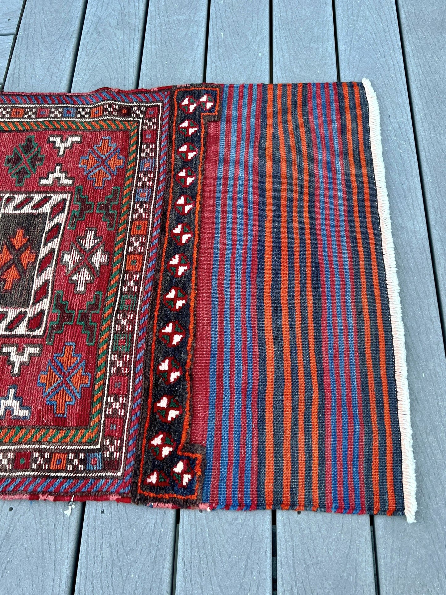 Vintage Bakhtiari Khorjin saddle bag rug 2x6 — 1940s Persian tribal runner handwoven with flatweave, pile, and soumak techniques in crimson, indigo, orange, and ivory — antique wool rug from Northwest Persia, Indigo Rugs Burlingame CA.
