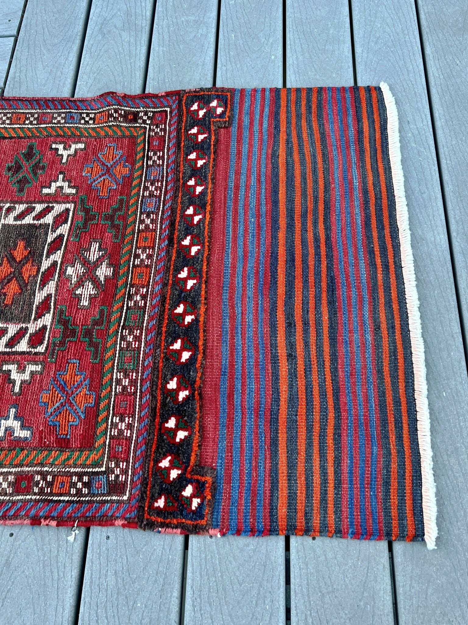 Vintage Bakhtiari Khorjin saddle bag rug 2x6 — 1940s Persian tribal runner handwoven with flatweave, pile, and soumak techniques in crimson, indigo, orange, and ivory — antique wool rug from Northwest Persia, Indigo Rugs Burlingame CA.