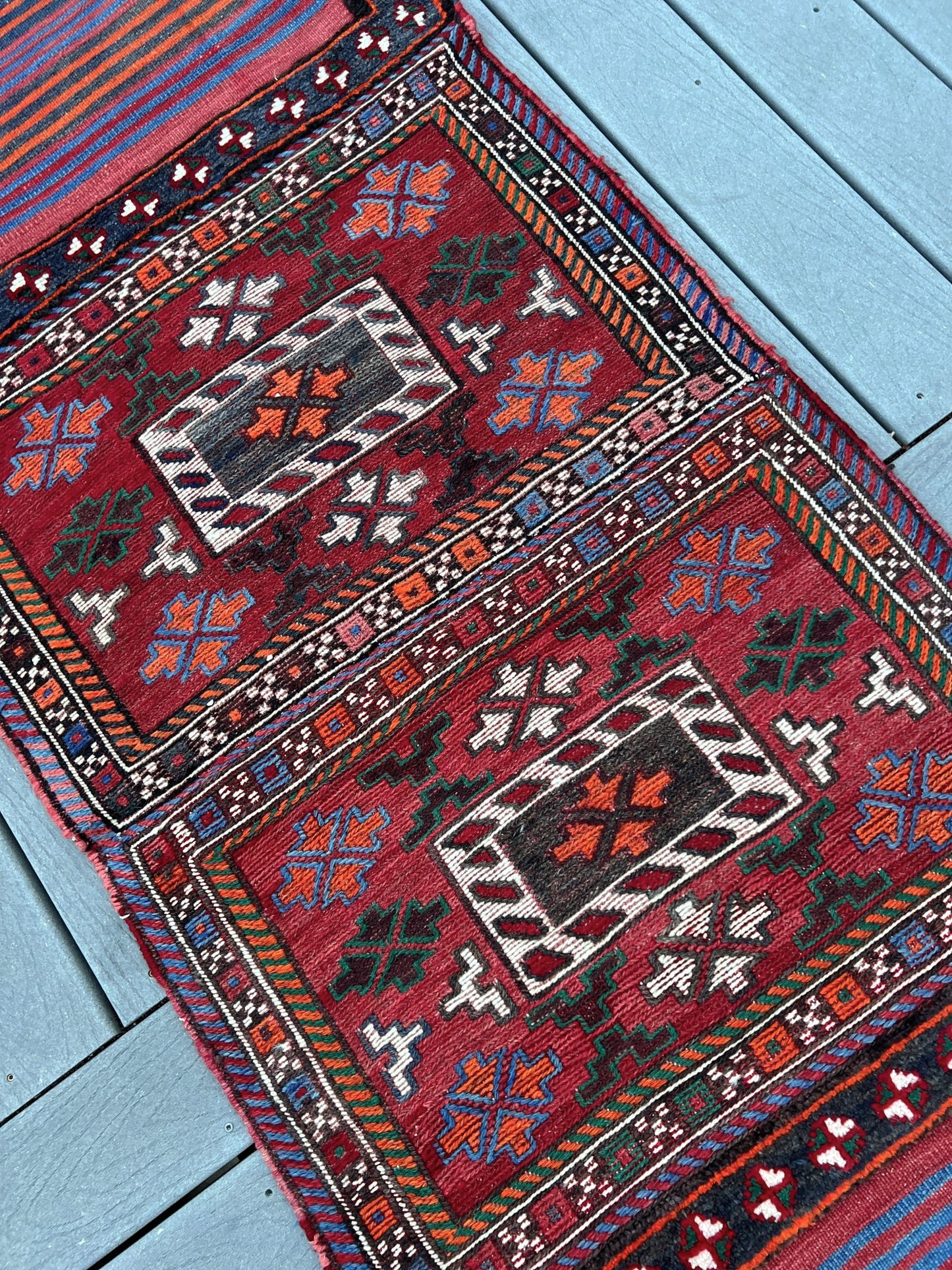 Vintage Bakhtiari Khorjin saddle bag rug 2x6 — 1940s Persian tribal runner handwoven with flatweave, pile, and soumak techniques in crimson, indigo, orange, and ivory — antique wool rug from Northwest Persia, Indigo Rugs Burlingame CA.