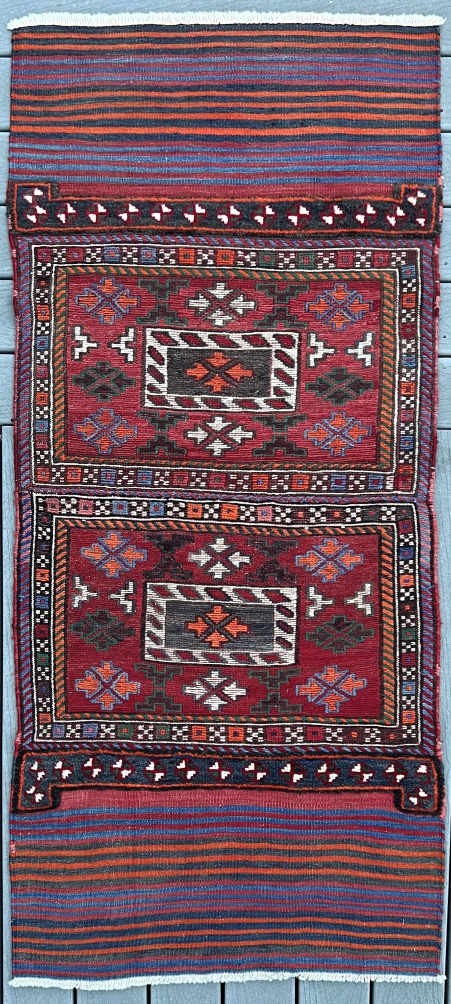 Vintage Bakhtiari Khorjin saddle bag rug 2x6 — 1940s Persian tribal runner handwoven with flatweave, pile, and soumak techniques in crimson, indigo, orange, and ivory — antique wool rug from Northwest Persia, Indigo Rugs Burlingame CA.