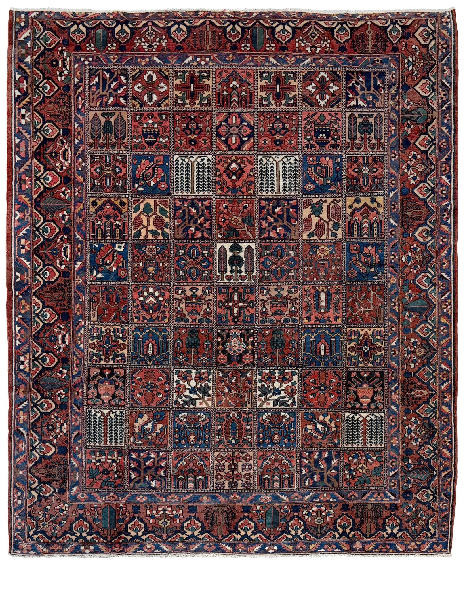 10x13 handmade Persian Bakhtiari vintage rug with garden panel design, floral motifs, and red and navy tones — shown in living room at Indigo Rugs, Burlingame — San Francisco Bay Area with free shipping