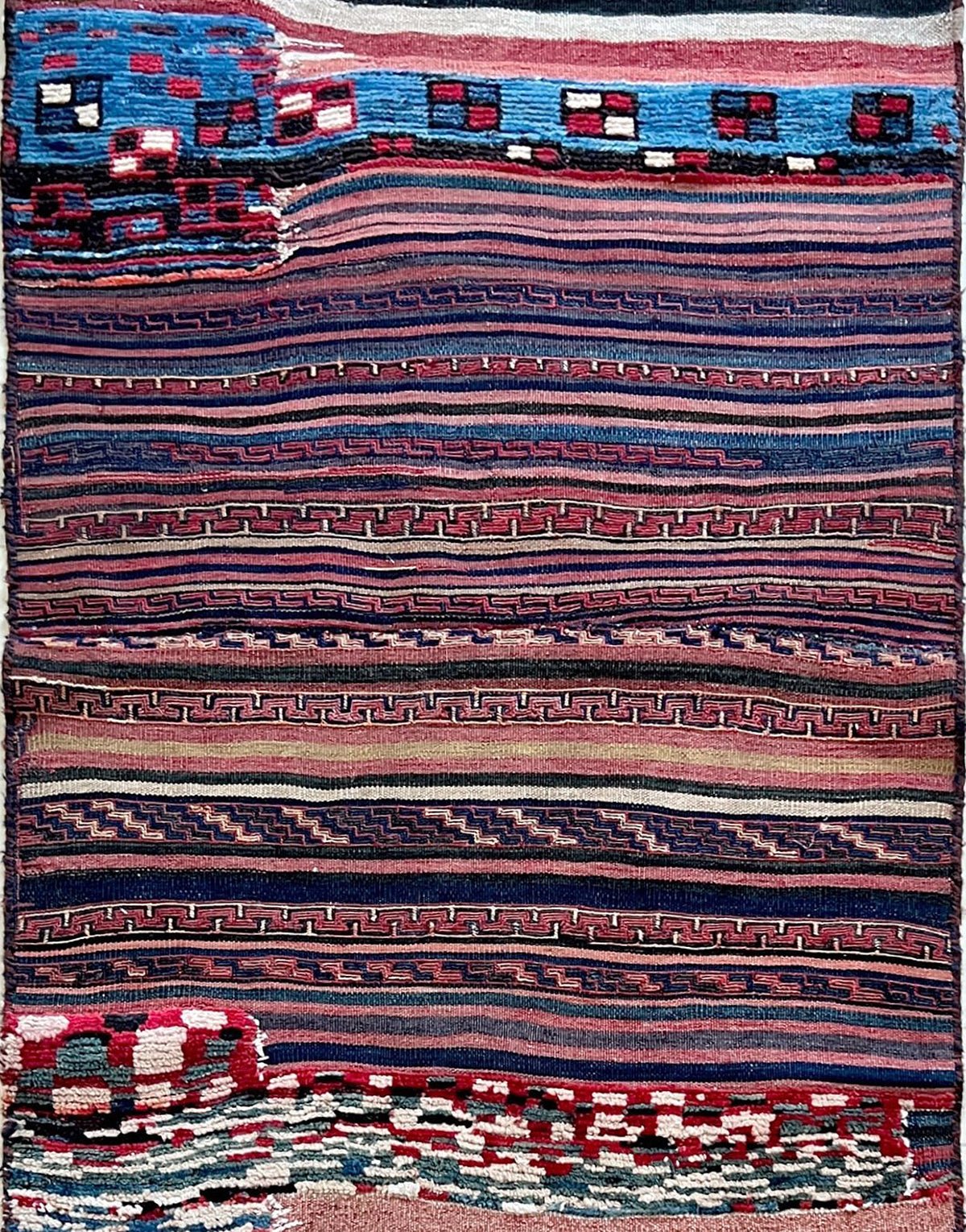 Vintage Bakhtiari saddle bag rug (3'1"x5'9") featuring handspun wool, taupe and indigo stripes, rose and blue tribal accents, and rare triple-weave construction — handmade in NW Persia, circa 1940s