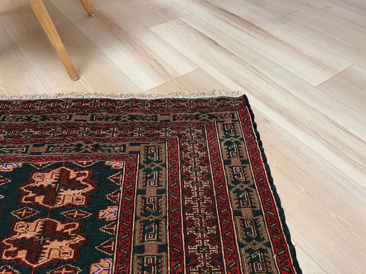 Vintage Caucasian Soumak flatweave rug with dark red, black, brown, madder red rose motifs, and intricate tribal borders — handmade wool wall hanging, Indigo Rugs, the best rug shop in San Francisco Bay Area, Burlingame CA