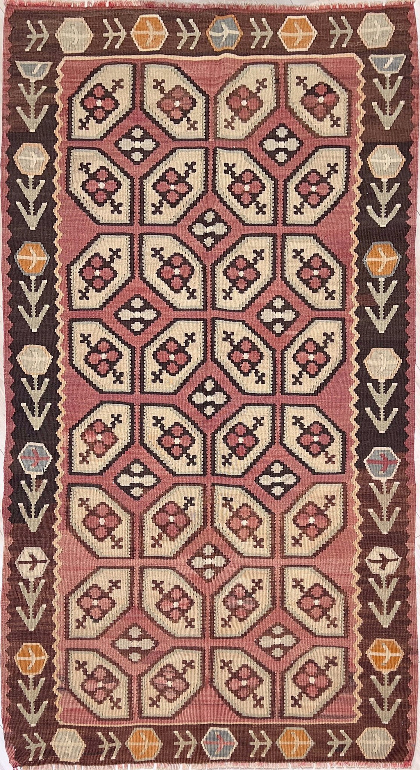 Vintage Floral Balkan kilim flatweave rug in blush terracotta, cream, and cocoa brown with geometric floral motifs — handmade wool wall hanging from the 1960s, available at Indigo Rugs, the best rug shop in San Francisco Bay Area, Burlingame CA.