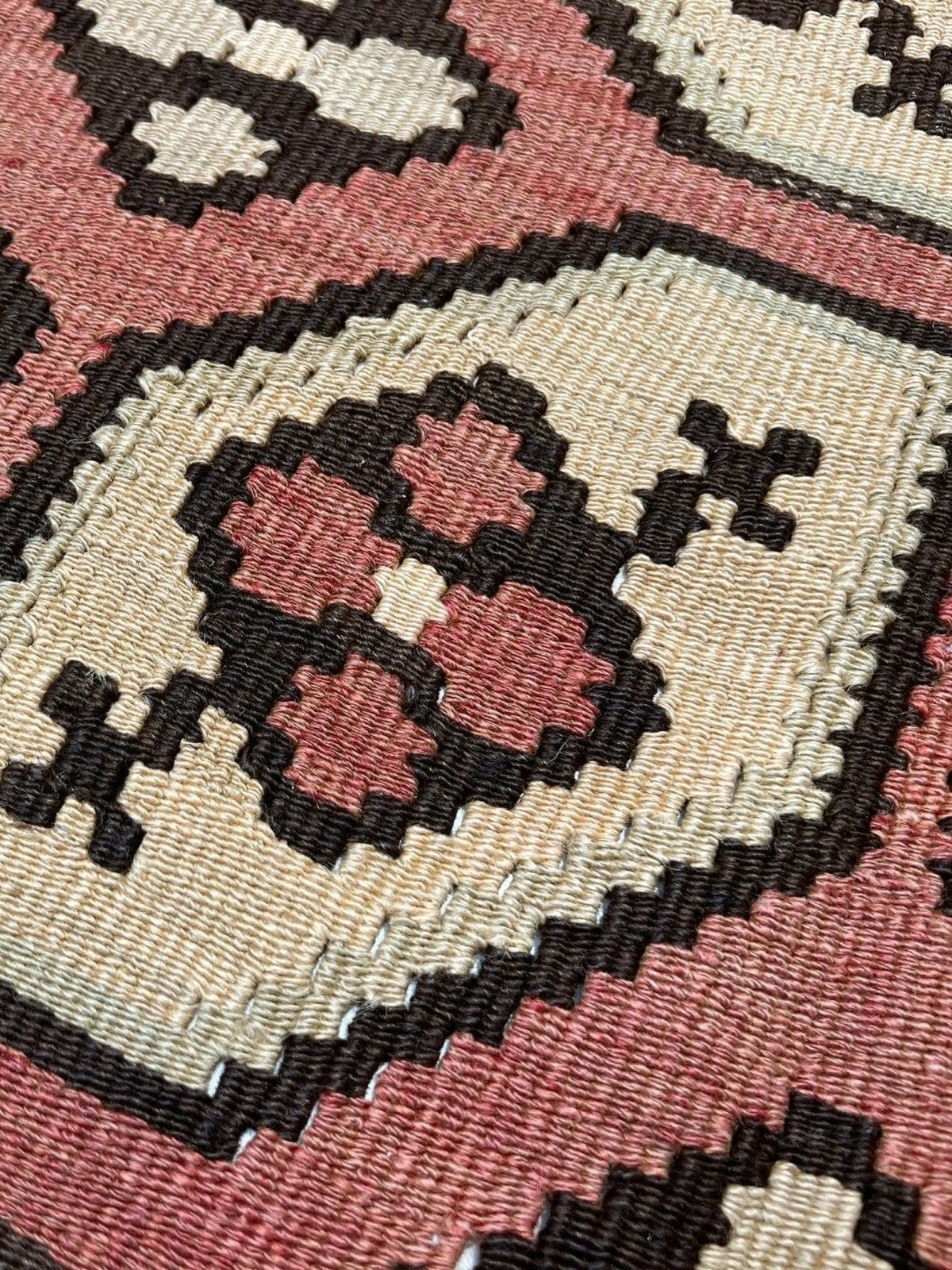 Vintage Floral Balkan kilim rug in brown earthy tones with geometric floral motifs — handmade wool rug, available at Indigo Rugs, the best rug shop in San Francisco Bay Area, Burlingame CA.