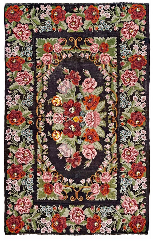 Vintage Moldovan rose floral kilim rug, 8x13, with black-brown field and large floral bouquet design in pink, red, sage, lavender, and sky blue tones.