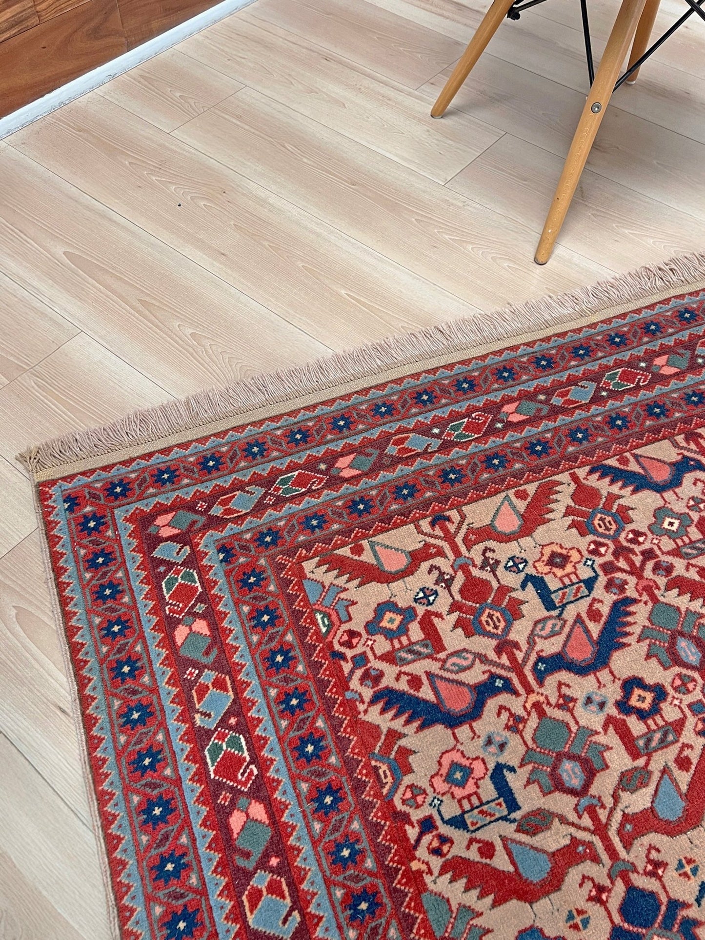 Brand new 6x9 handmade Turkish Tree of Life rug in muted peach with birds, floral motifs, coral red and blue accents, traditional wool area rug from Indigo Rugs Burlingame Bay Area.