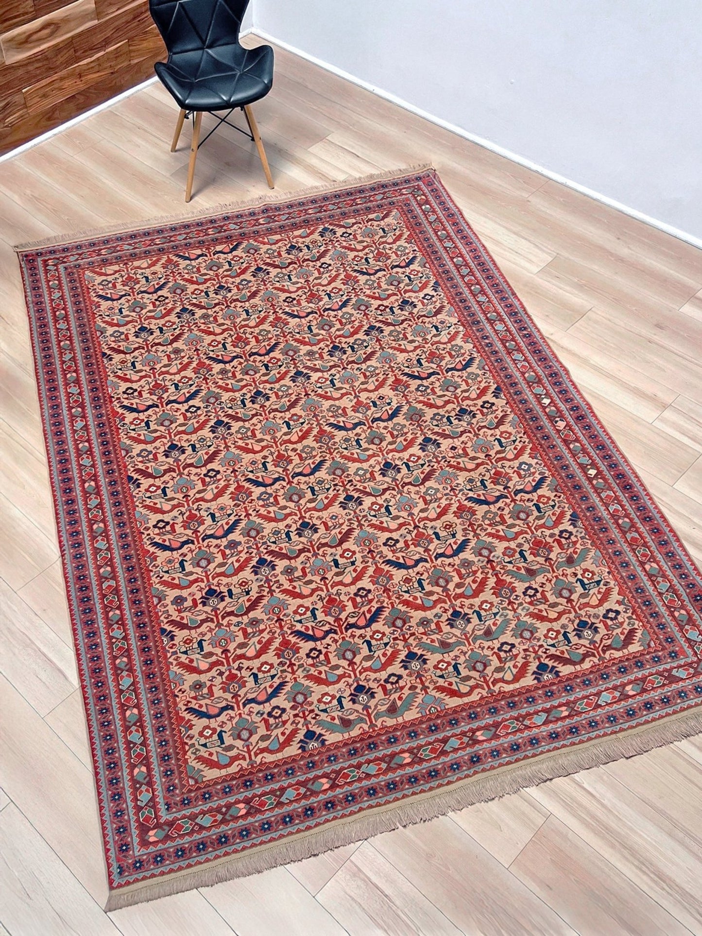 Brand new 6x9 handmade Turkish Tree of Life rug in muted peach with birds, floral motifs, coral red and blue accents, traditional wool area rug from Indigo Rugs Burlingame Bay Area.