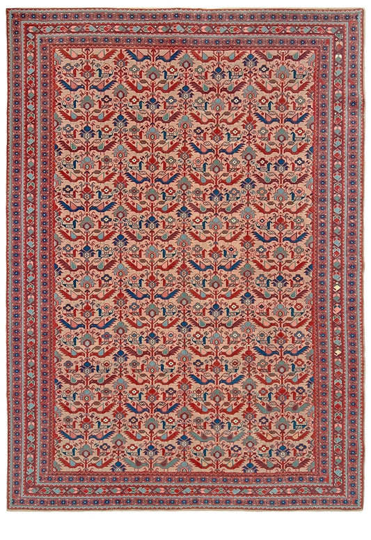 Brand new 6x9 handmade Turkish Tree of Life rug in pale salmon pink with birds, floral motifs, coral red and blue accents, traditional wool area rug from Indigo Rugs Burlingame Bay Area.