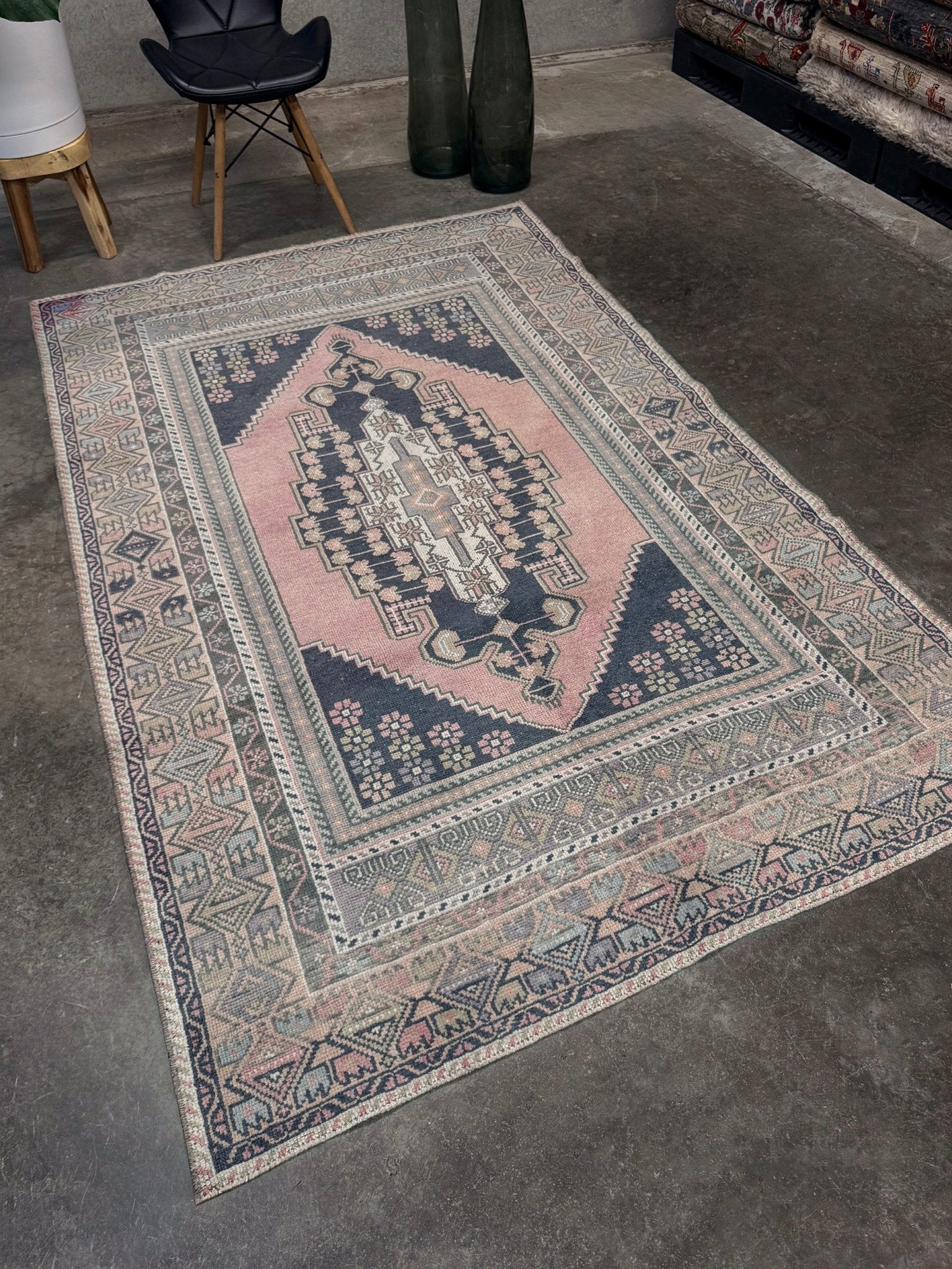 pastel vintage turkish obruk rug 4x7 handwoven anatolian wool rug dusty rose field charcoal navy medallion floral border low pile vintage rug indigo rugs san francisco bay area