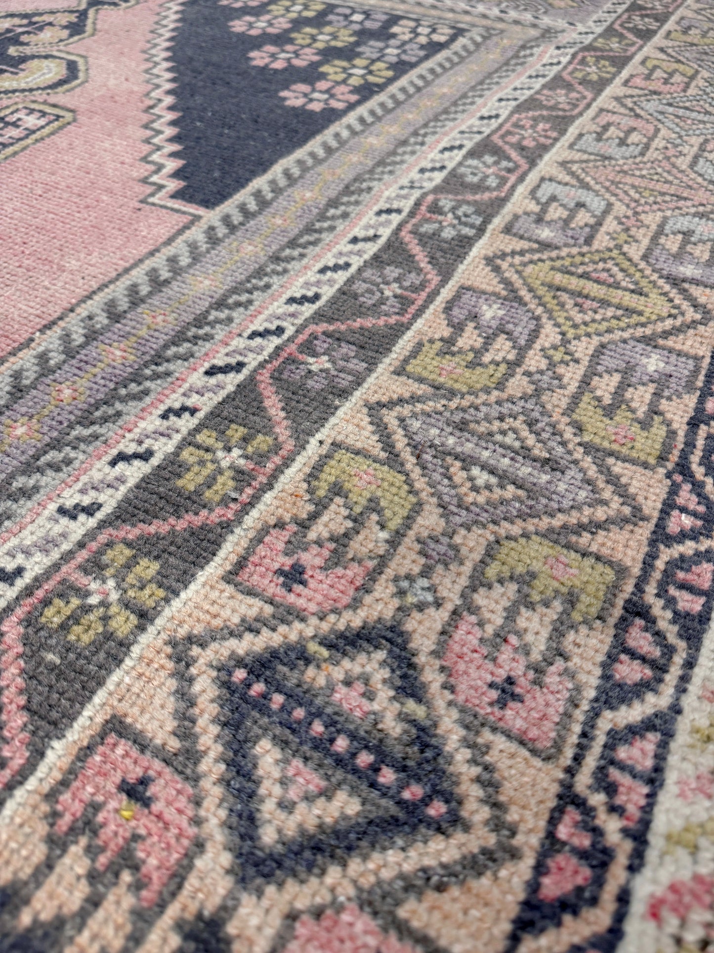 pastel vintage turkish obruk rug 4x7 handwoven anatolian wool rug dusty rose field charcoal navy medallion floral border low pile vintage rug indigo rugs san francisco bay area