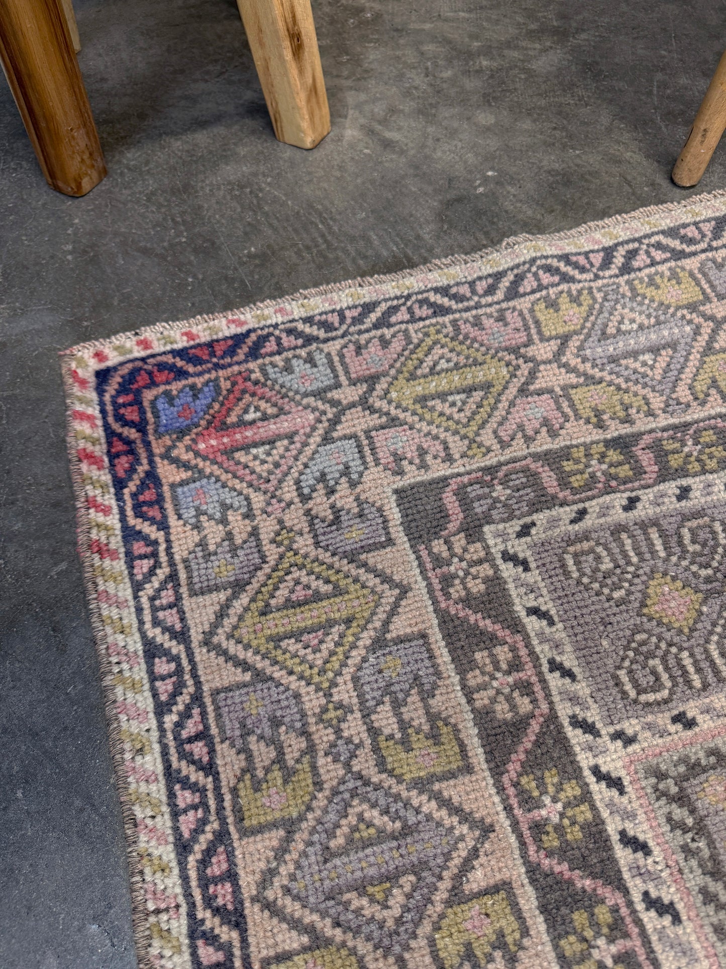 pastel vintage turkish obruk rug 4x7 handwoven anatolian wool rug dusty rose field charcoal navy medallion floral border low pile vintage rug indigo rugs san francisco bay area