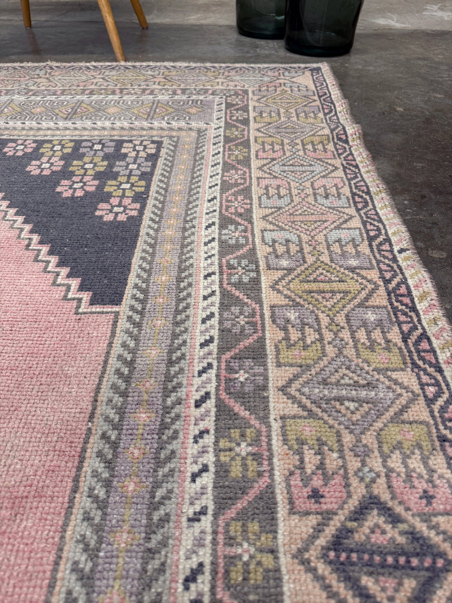 pastel vintage turkish obruk rug 4x7 handwoven anatolian wool rug dusty rose field charcoal navy medallion floral border low pile vintage rug indigo rugs san francisco bay area