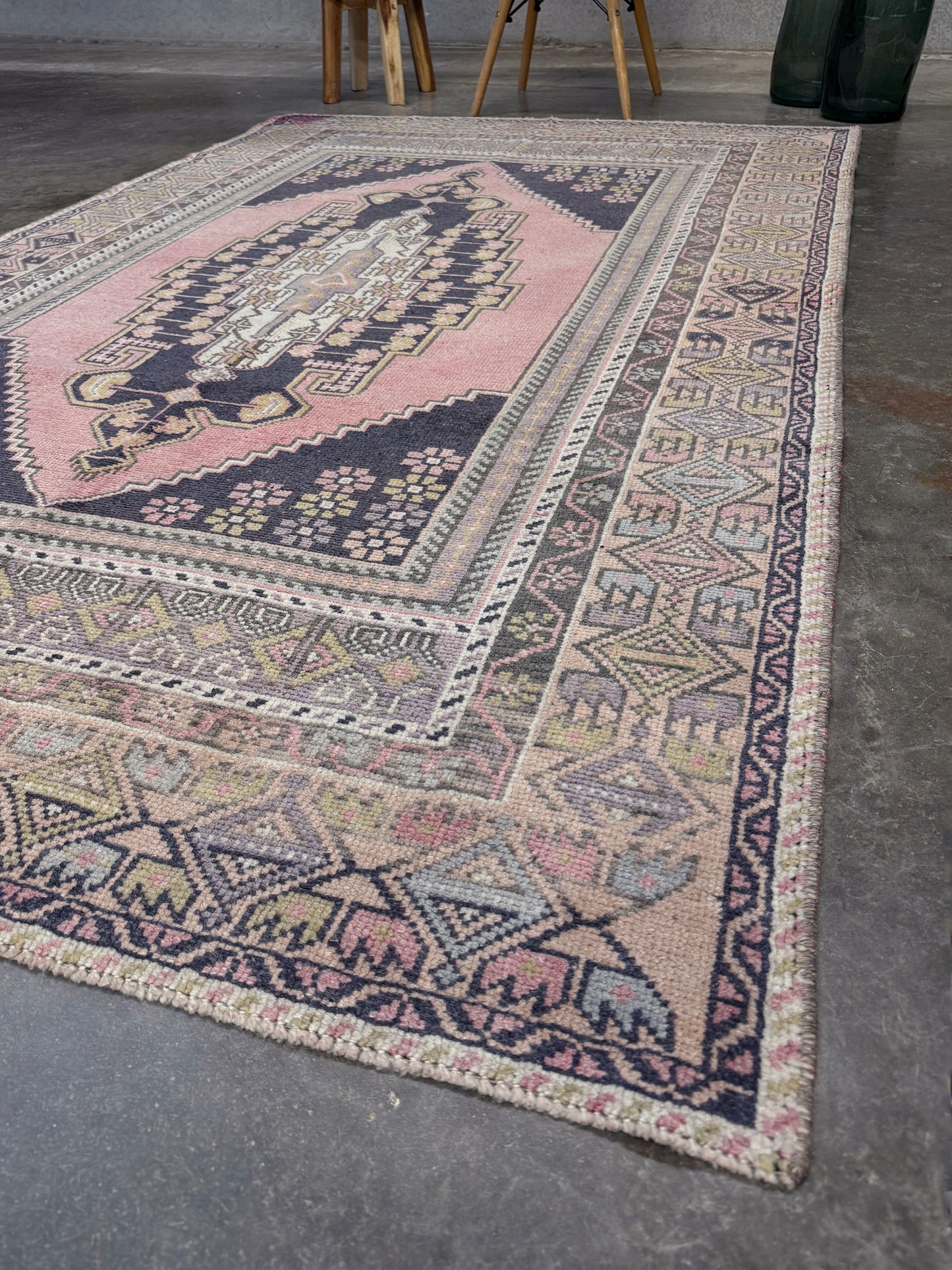 pastel vintage turkish obruk rug 4x7 handwoven anatolian wool rug dusty rose field charcoal navy medallion floral border low pile vintage rug indigo rugs san francisco bay area