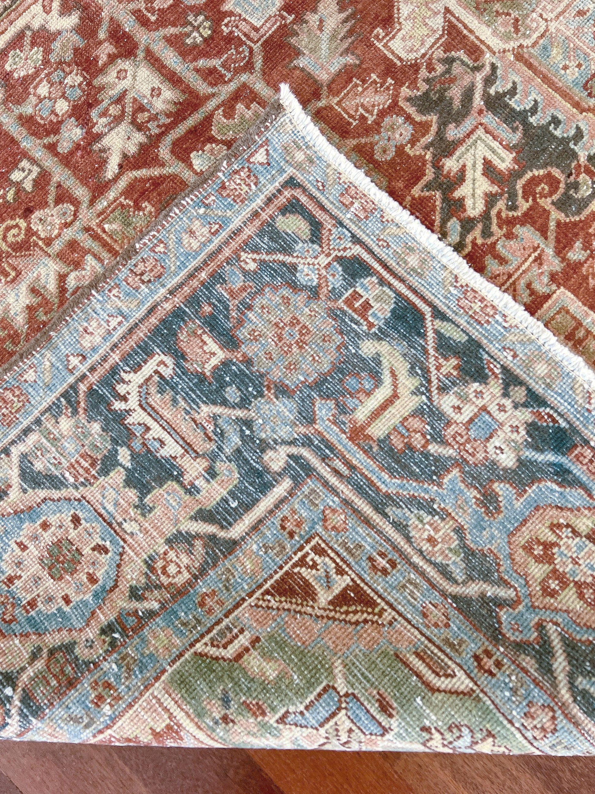 Rust Red Vintage Persian Serapi Heriz area rug. 8x11 Geometric medallion, low pile wool handmade rug ideal for living rooms, bedrooms, dining rooms. from Indigo Rugs, Burlingame — the best rug shop in the San Francisco Bay Area. Free shipping.