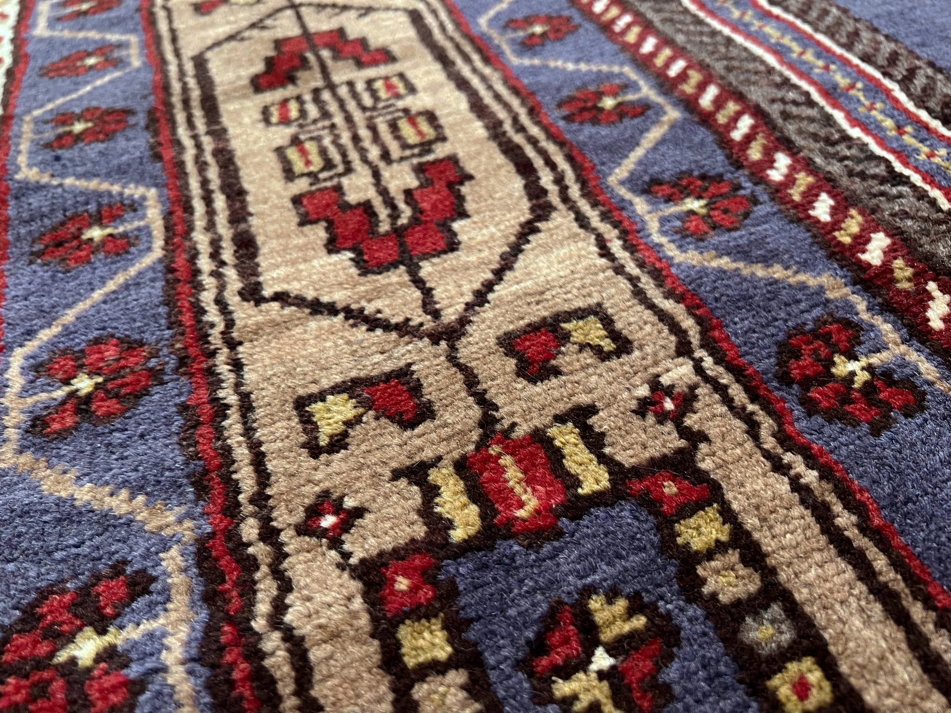 Vintage Taspinar Turkish rug (6x9) with ivory, brick red, and indigo medallion design—handmade wool, strong pile, excellent condition. Perfect for living rooms, bedrooms, or kitchens. Durable, tribal geometric style. Free shipping from Indigo Rugs, the best rug shop in Burlingame, Bay Area.