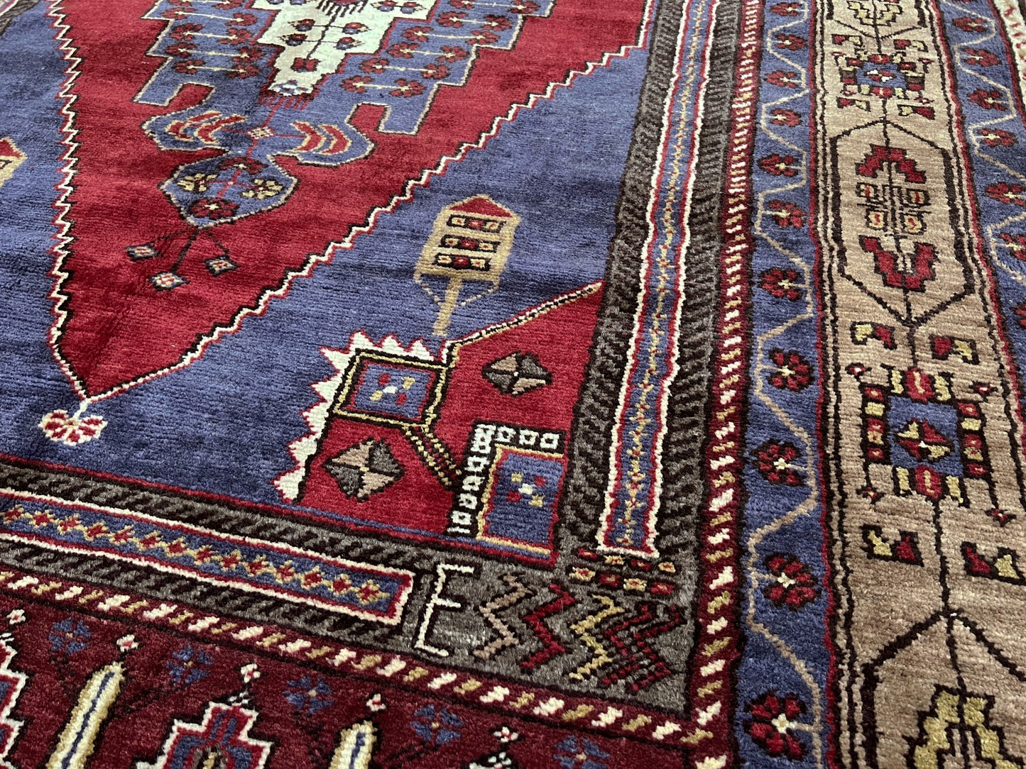 Vintage Taspinar Turkish rug (6x9) with ivory, brick red, and indigo medallion design—handmade wool, strong pile, excellent condition. Perfect for living rooms, bedrooms, or kitchens. Durable, tribal geometric style. Free shipping from Indigo Rugs, the best rug shop in Burlingame, Bay Area.