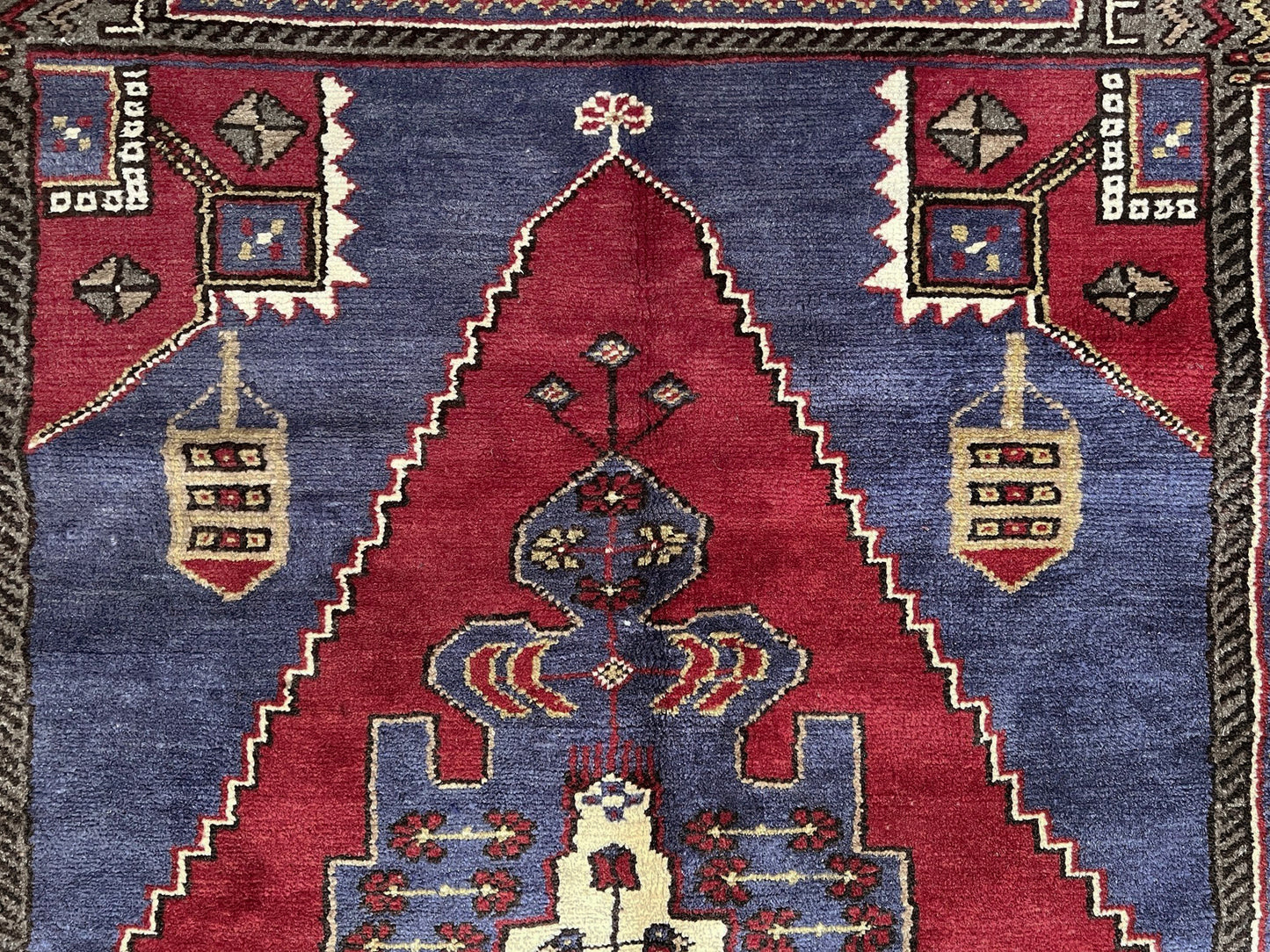 Vintage Taspinar Turkish rug (6x9) with ivory, brick red, and indigo medallion design—handmade wool, strong pile, excellent condition. Perfect for living rooms, bedrooms, or kitchens. Durable, tribal geometric style. Free shipping from Indigo Rugs, the best rug shop in Burlingame, Bay Area.
