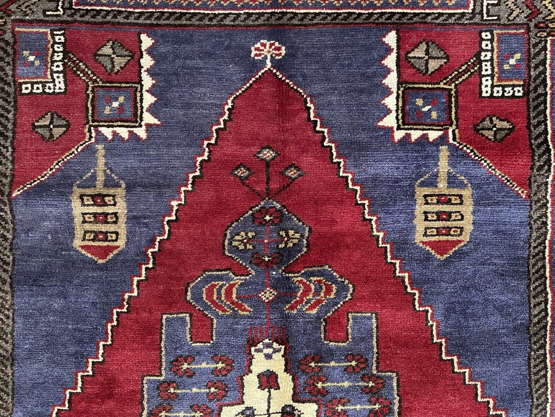 Vintage Taspinar Turkish rug (6x9) with ivory, brick red, and indigo medallion design—handmade wool, strong pile, excellent condition. Perfect for living rooms, bedrooms, or kitchens. Durable, tribal geometric style. Free shipping from Indigo Rugs, the best rug shop in Burlingame, Bay Area.