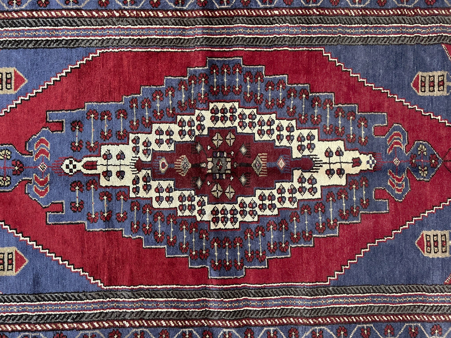 Vintage Taspinar Turkish rug (6x9) with ivory, brick red, and indigo medallion design—handmade wool, strong pile, excellent condition. Perfect for living rooms, bedrooms, or kitchens. Durable, tribal geometric style. Free shipping from Indigo Rugs, the best rug shop in Burlingame, Bay Area.