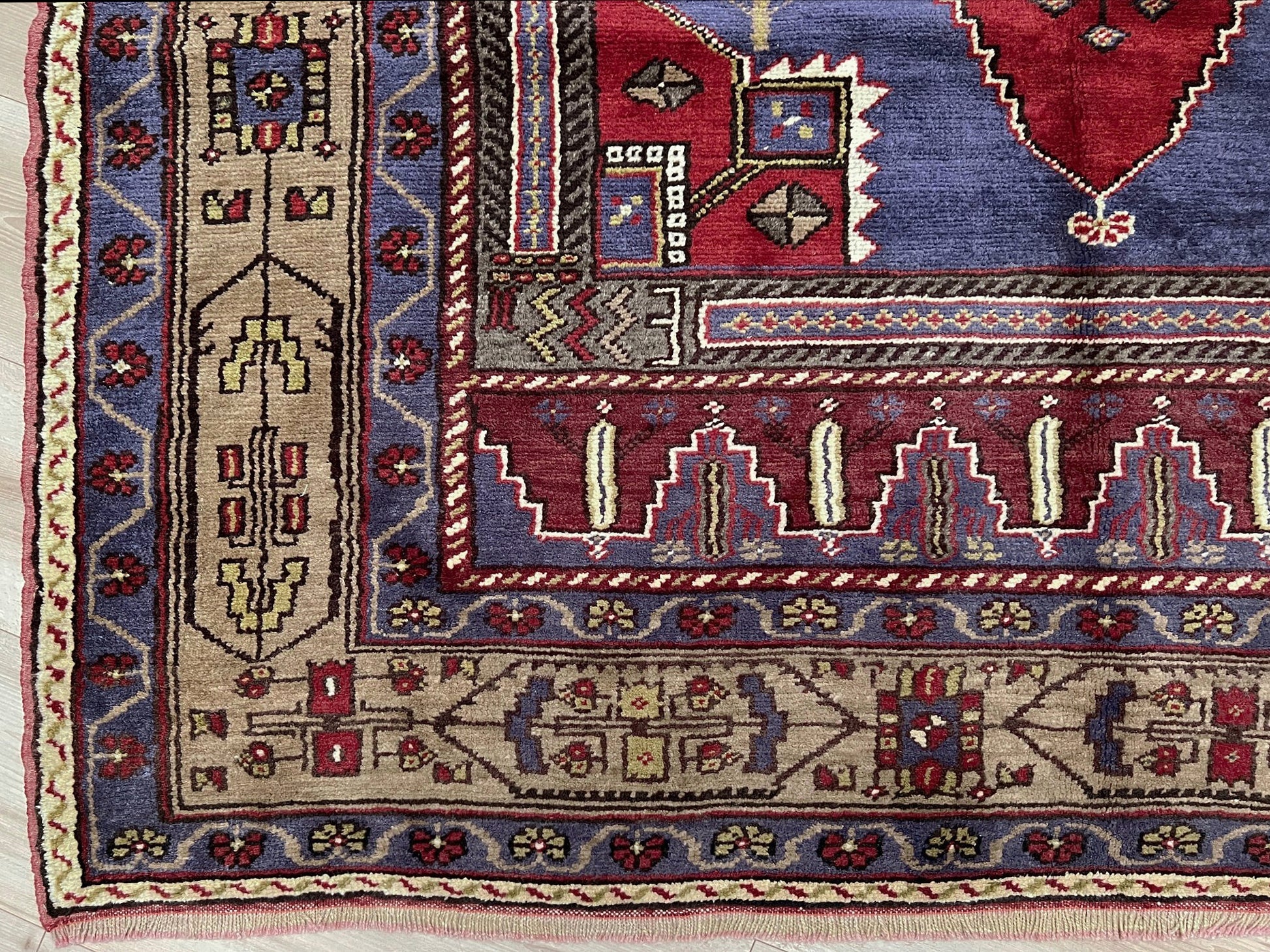 Vintage Taspinar Turkish rug (6x9) with ivory, brick red, and indigo medallion design—handmade wool, strong pile, excellent condition. Perfect for living rooms, bedrooms, or kitchens. Durable, tribal geometric style. Free shipping from Indigo Rugs, the best rug shop in Burlingame, Bay Area.