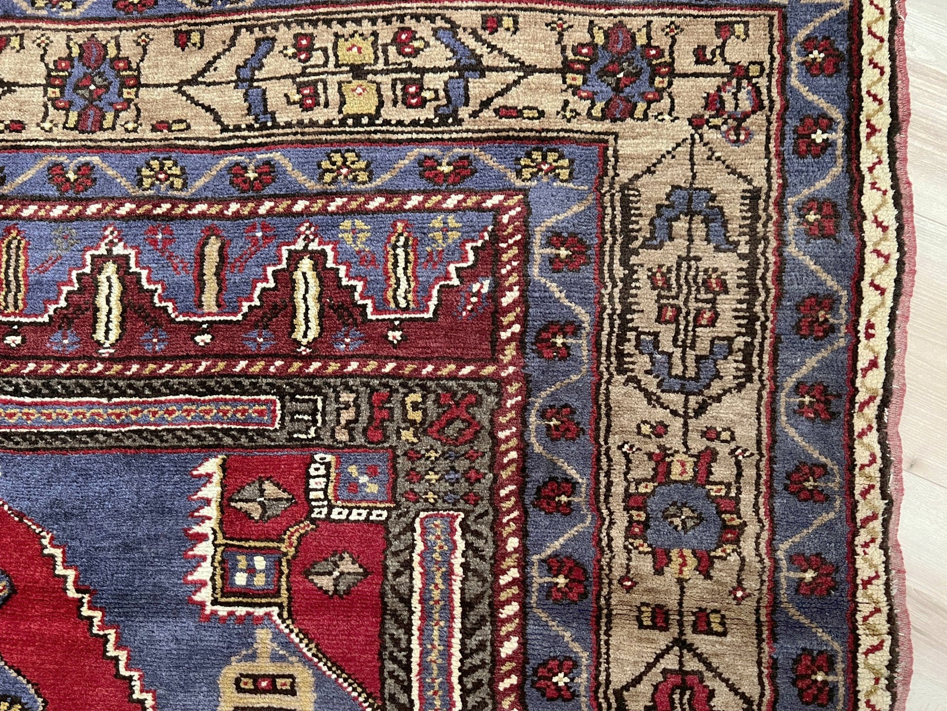 Vintage Taspinar Turkish rug (6x9) with ivory, brick red, and indigo medallion design—handmade wool, strong pile, excellent condition. Perfect for living rooms, bedrooms, or kitchens. Durable, tribal geometric style. Free shipping from Indigo Rugs, the best rug shop in Burlingame, Bay Area.