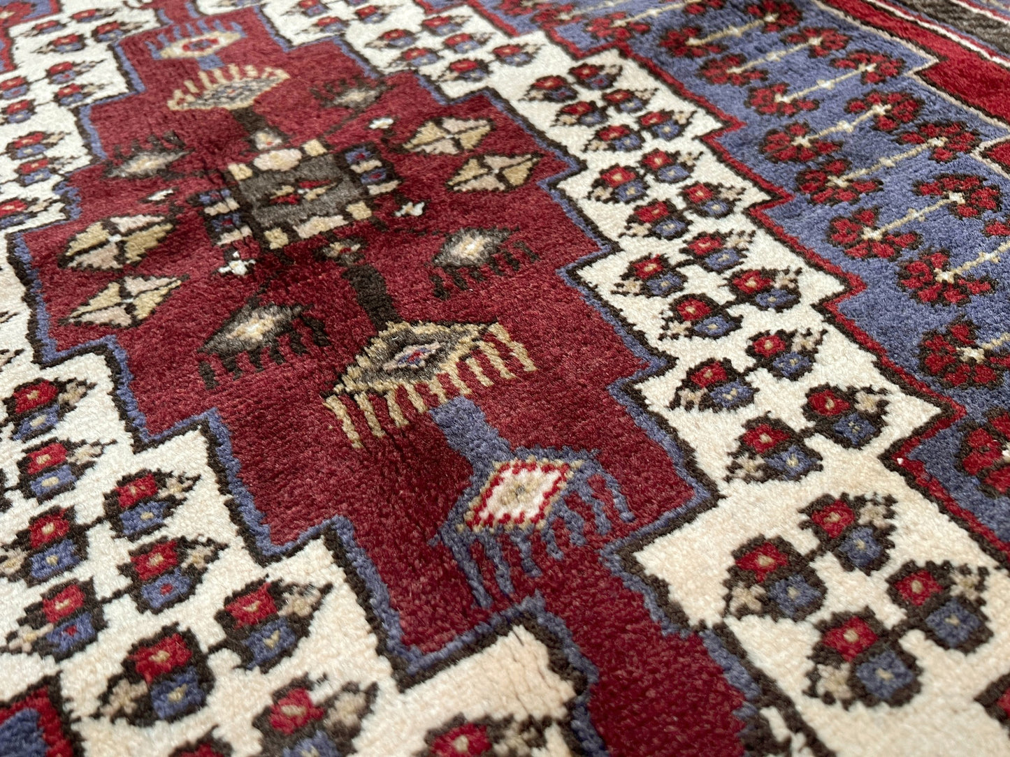 Vintage Taspinar Turkish rug (6x9) with ivory, brick red, and indigo medallion design—handmade wool, strong pile, excellent condition. Perfect for living rooms, bedrooms, or kitchens. Durable, tribal geometric style. Free shipping from Indigo Rugs, the best rug shop in Burlingame, Bay Area.
