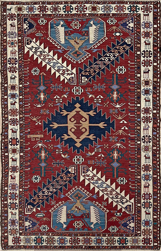 Vintage Shahsavan Soumak flatweave rug from Northwest Iran featuring red, ivory, and blue tribal medallions — handmade Persian wool 3x5 wall hanging, available at Indigo Rugs, the best rug shop in San Francisco Bay Area, Burlingame CA.
