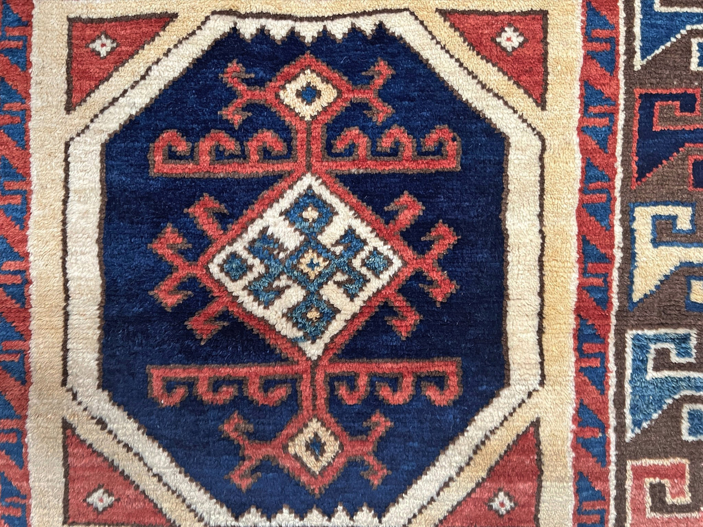 Turkish Konya handmade wool mini rug with geometric tribal medallion, navy field, and rust and ivory accents — 3×3.5 hand-knotted small carpet. square wool handmade Mini Rug rug shop san francisco bay area. Buy rug online free shipping USA Canada.