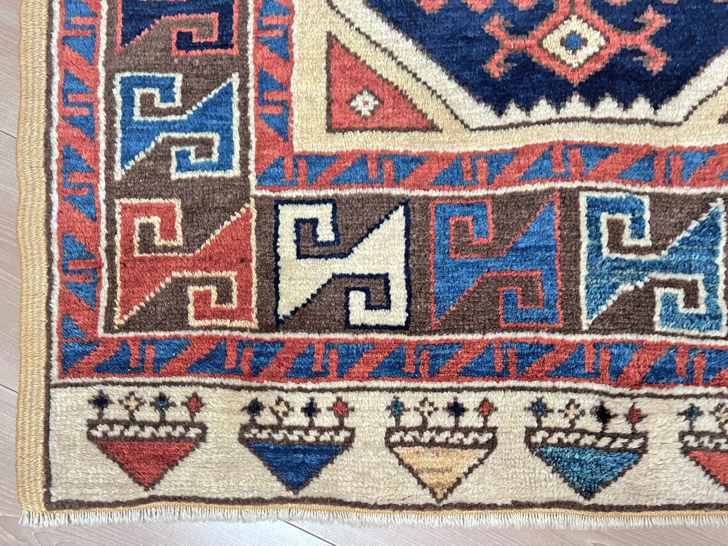 Turkish Konya handmade wool mini rug with geometric tribal medallion, navy field, and rust and ivory accents — 3×3.5 hand-knotted small carpet. square wool handmade Mini Rug rug shop san francisco bay area. Buy rug online free shipping USA Canada.
