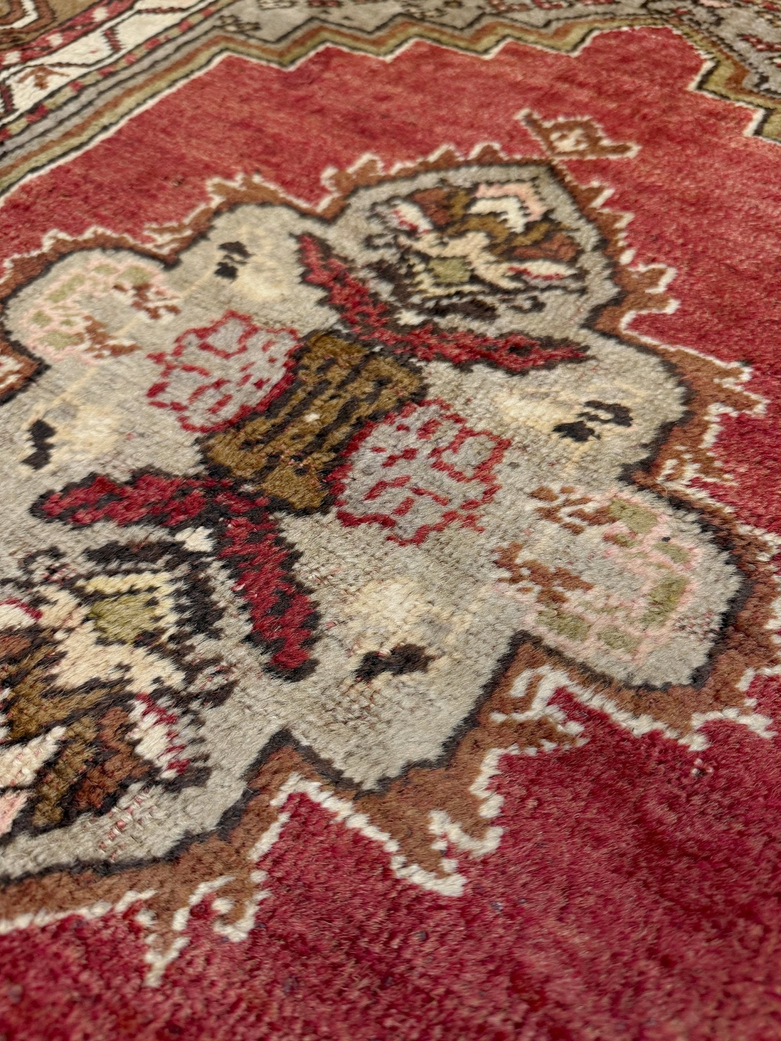 Vintage Turkish Kirsehir rug with russet red field and geometric medallion, hand-knotted wool pile on wool foundation, featuring camel, taupe, and faded gold floral borders — 1950s Anatolian small accent rug 3x5.