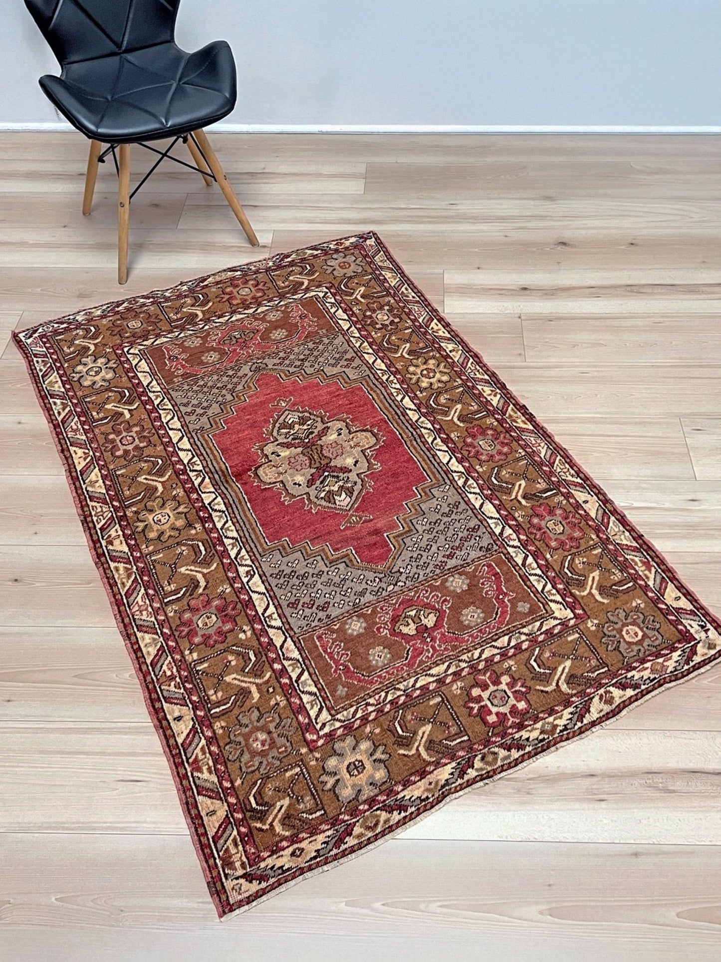Vintage Turkish Kirsehir rug with russet red field and geometric medallion, hand-knotted wool pile on wool foundation, featuring camel, taupe, and faded gold floral borders — 1950s Anatolian small accent rug 3x5.