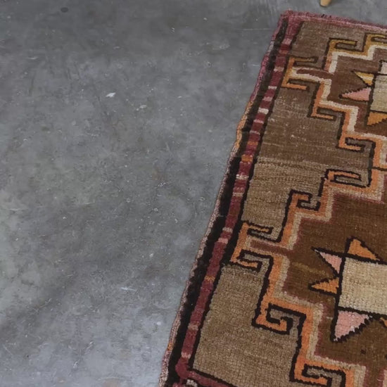 Earthy Vintage Turkish mini rug village rug with warm camel-beige field, stepped geometric star motifs, handmade wool rug measuring approximately 21 x 33 inches. From the best rug shop in SF Bay Area Burlingaöe CA. Free Shipping.