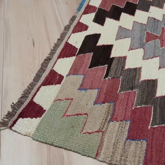 3x5 Vintage Mut kilim rug with Navajo-style stepped medallion design in clay red and charcoal — handwoven wool flatweave from 1970s Turkey, available at Indigo Rugs, Burlingame CA. Handmade rug with earth color for living room, bedroom, kitchen, study.