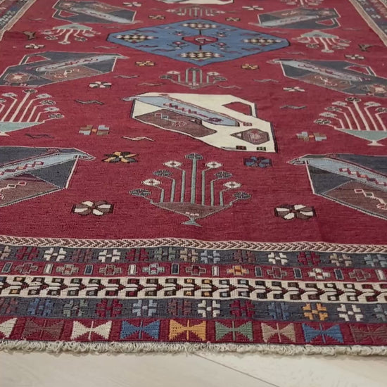 Vintage Armenian soumak rug with pictorial motifs in madder red, slate blue, ivory, and charcoal, 4x6 size.